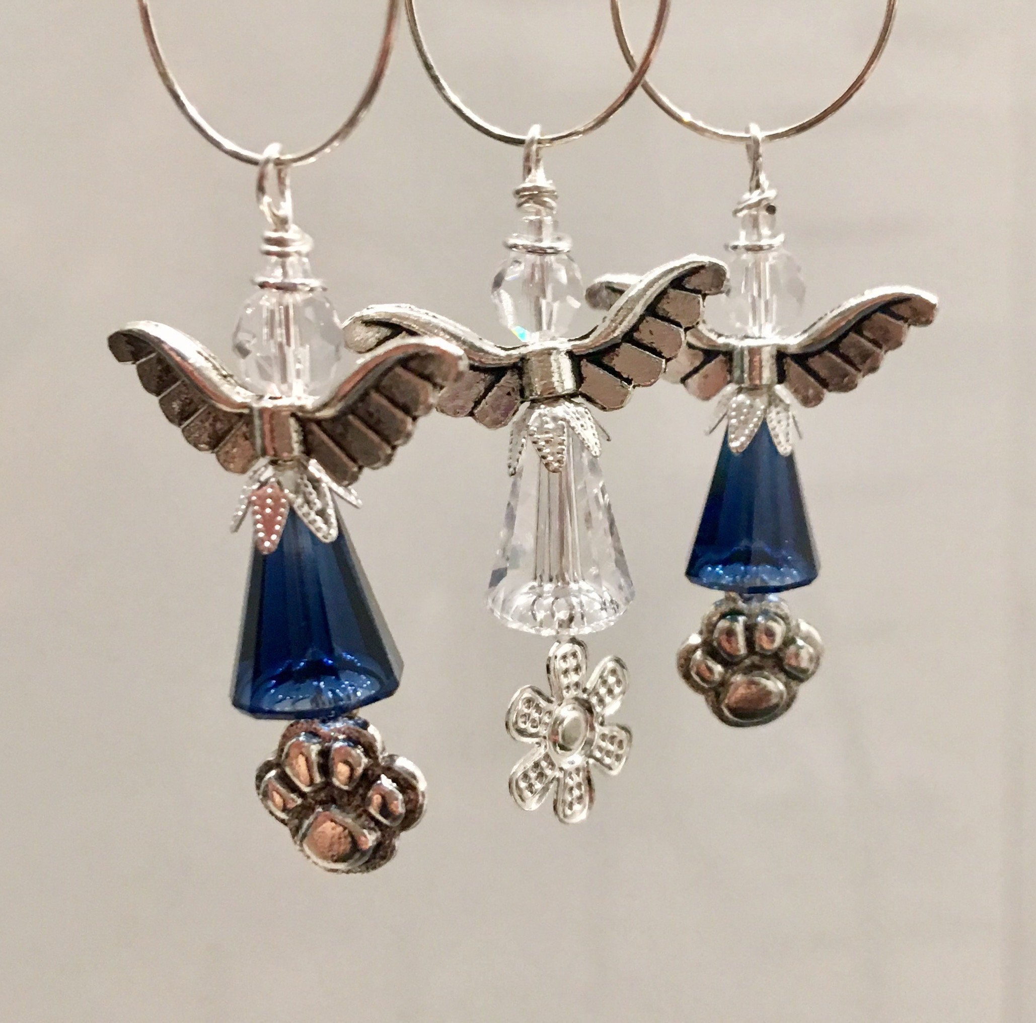 Paw print angels and a flower charmed angel