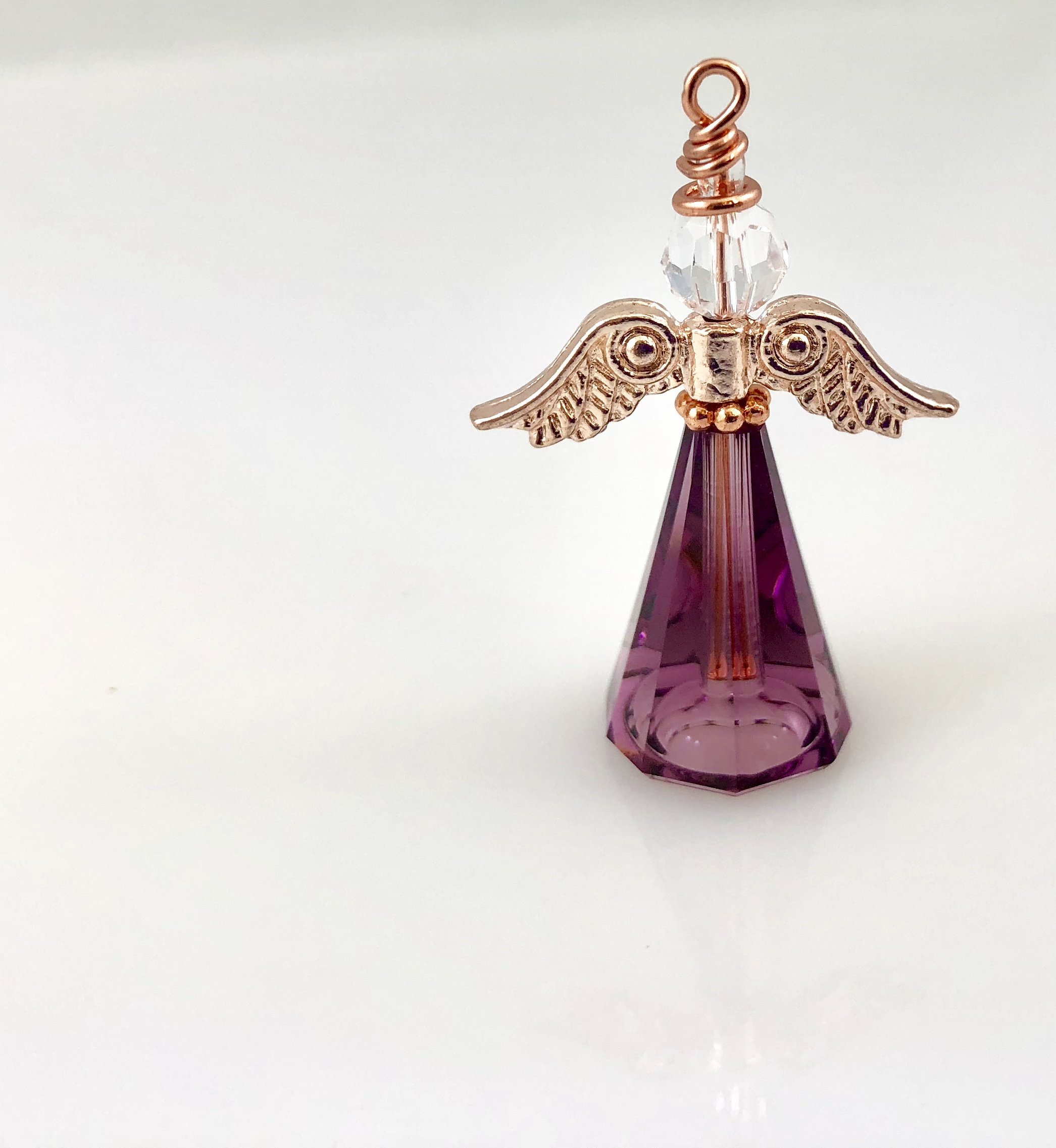 Large purple angel with rose gold wings