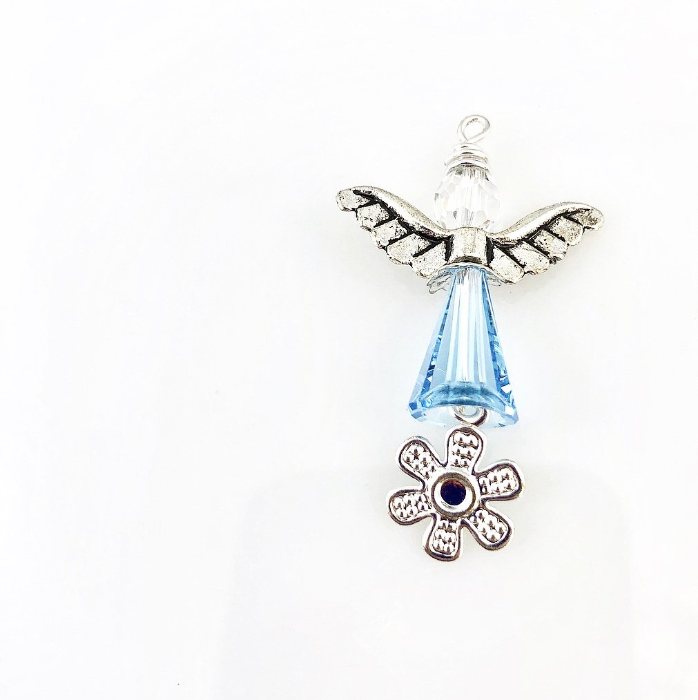 Small light blue angel with daisy charm