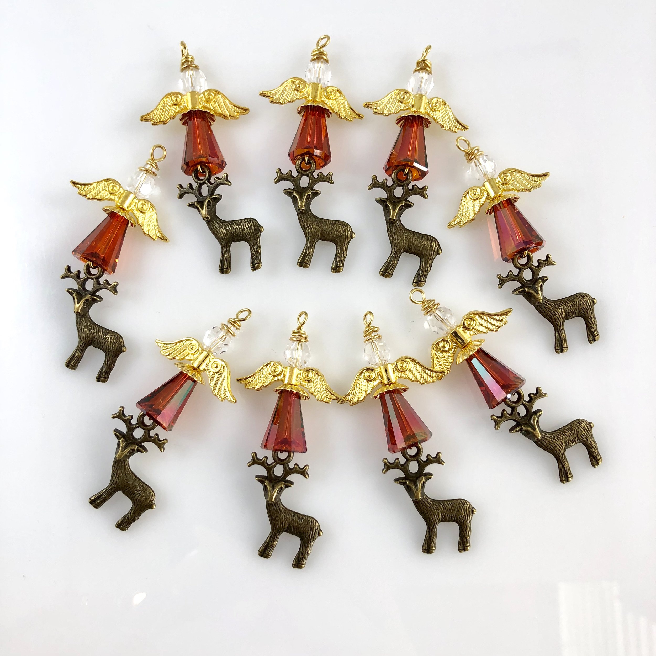 Small red angels with deer charms