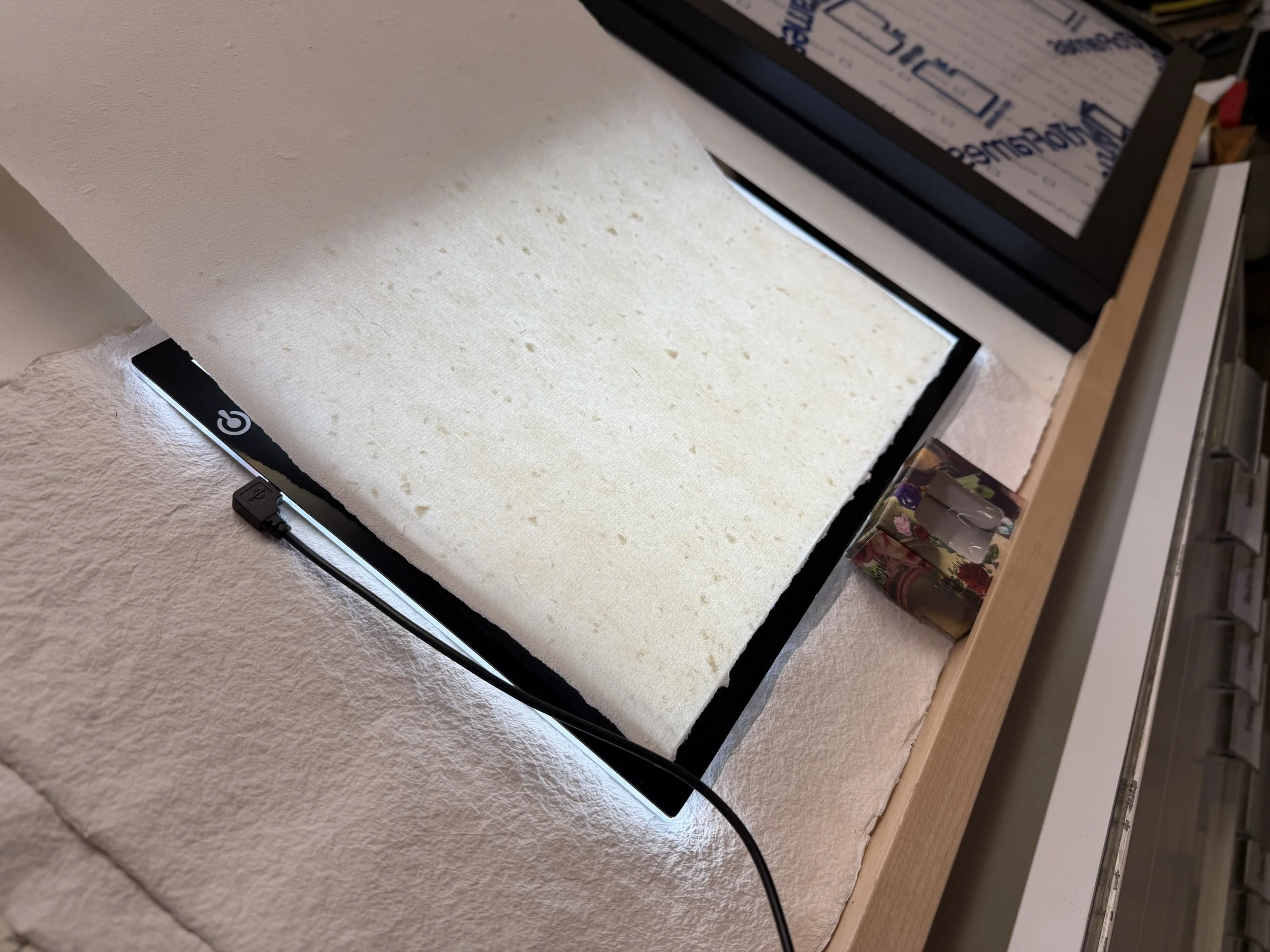 Magnolia Saper Studio: Inspecting a sheet riddled with knots