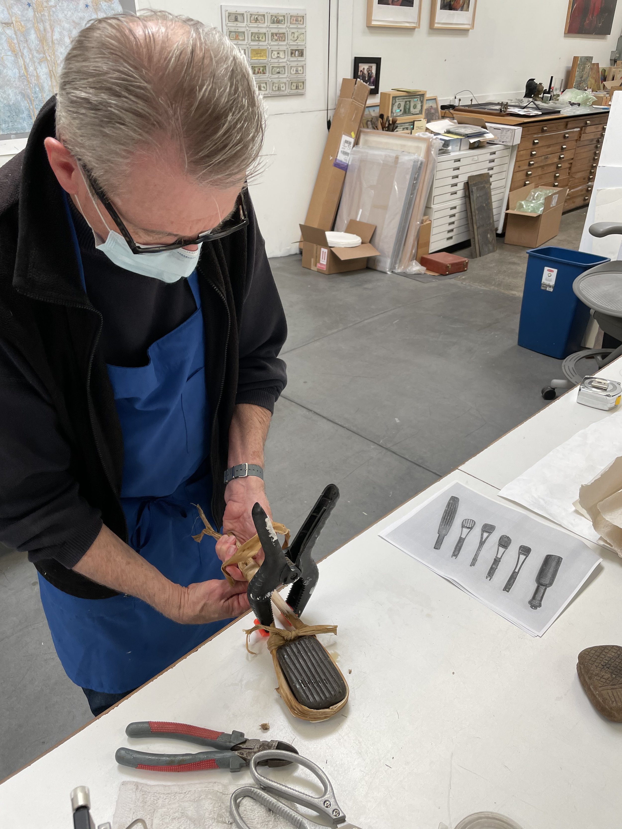 Guy Diehl making a handle for a Mayan amate beating stone
