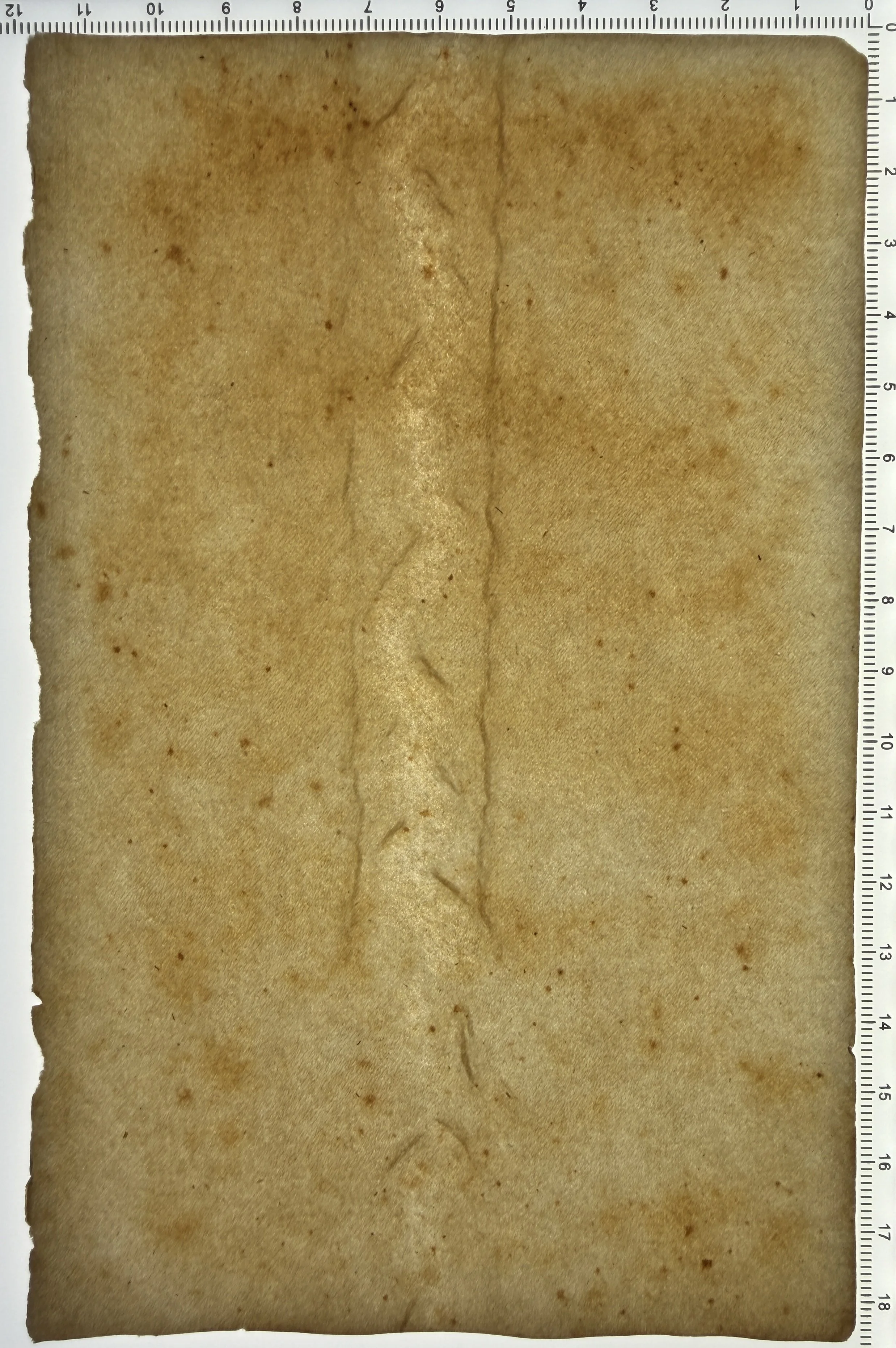 Unknown flaw #6: A wove sheet. Update: Cathy Baker suspects this is a tunnel —long air bubbles. Previously, we postulated percussion: A dropped mould edge on the top sheet of the post? Or a wave of furnish rising from under the mould during formation