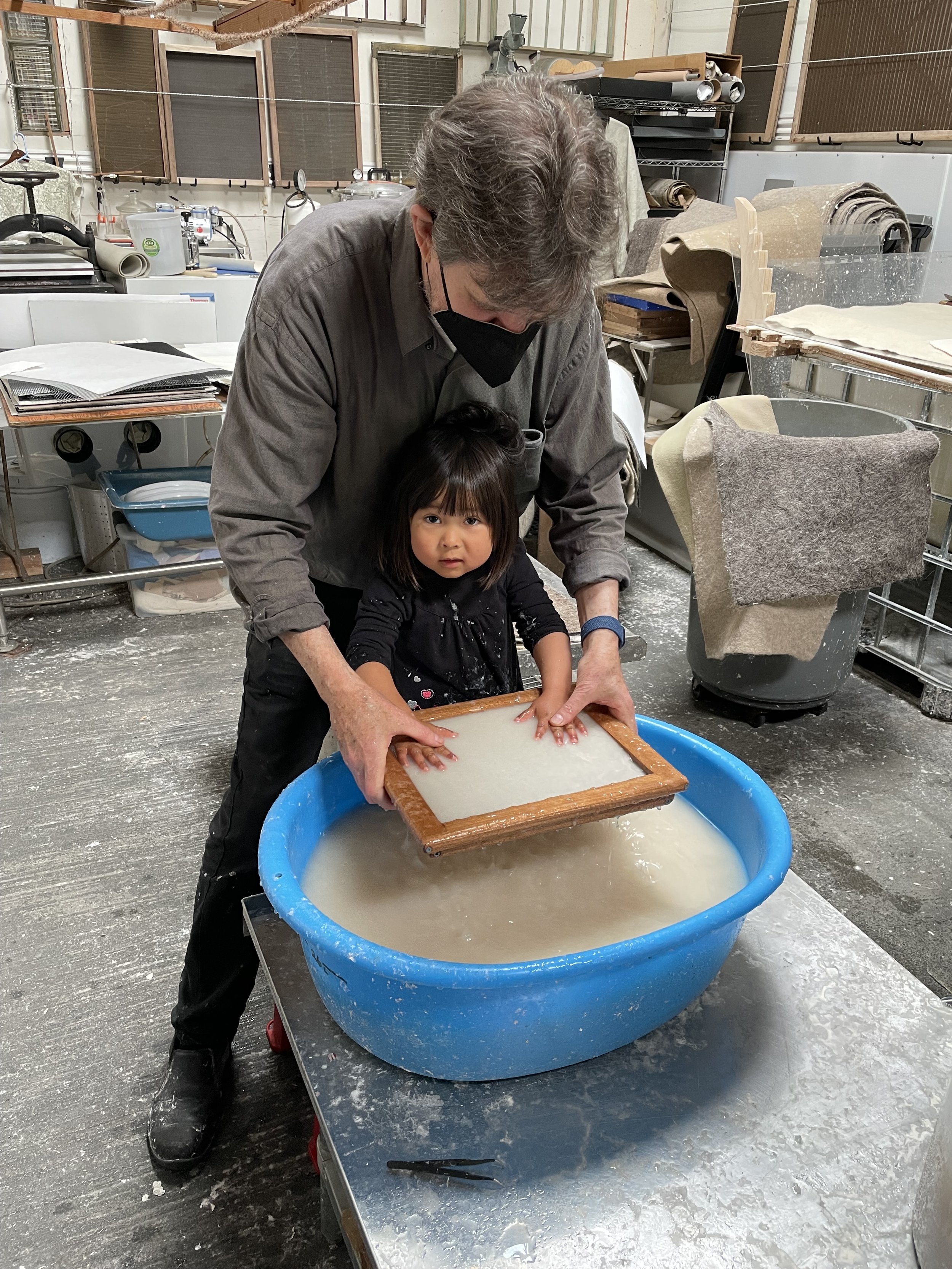 Making paper with granddaughter