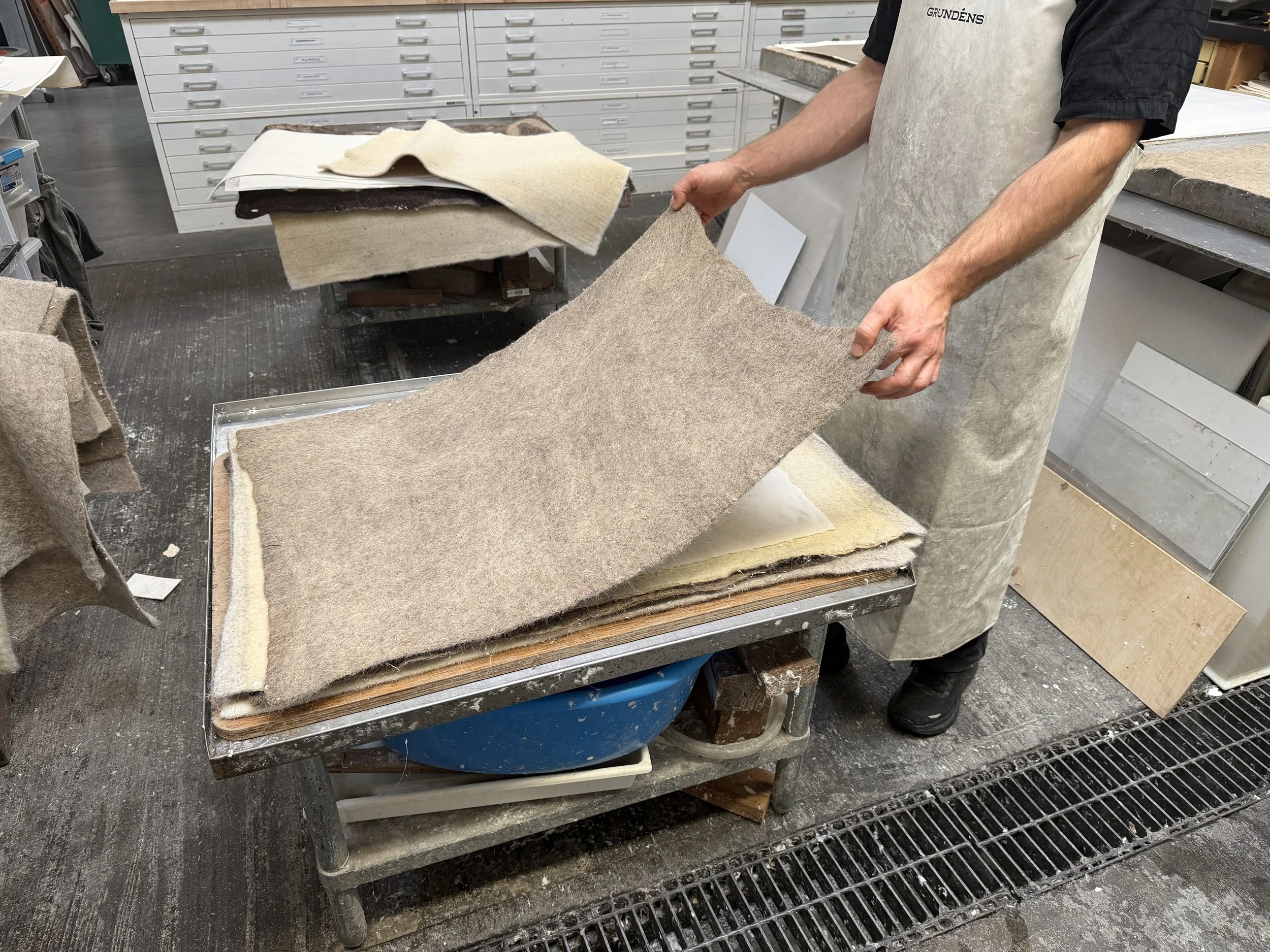 Magnolia Saper Studio: Dragging a felt to make drag marks on a newly couched sheet
