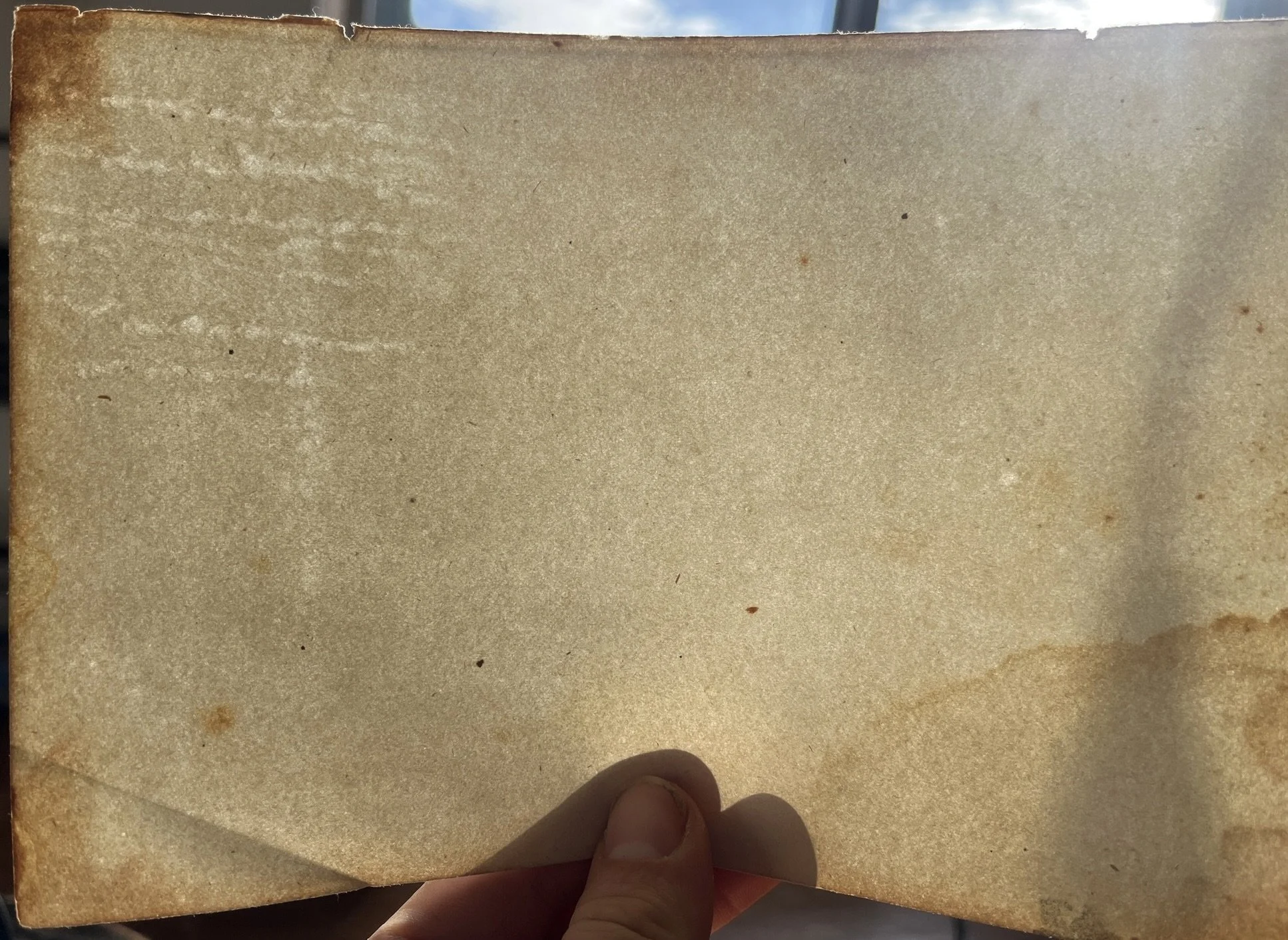 Unknown flaw #13 Very similar to flaw #11 & 12: but isolated to one corner of the sheet. Drips while the sheet is drying?