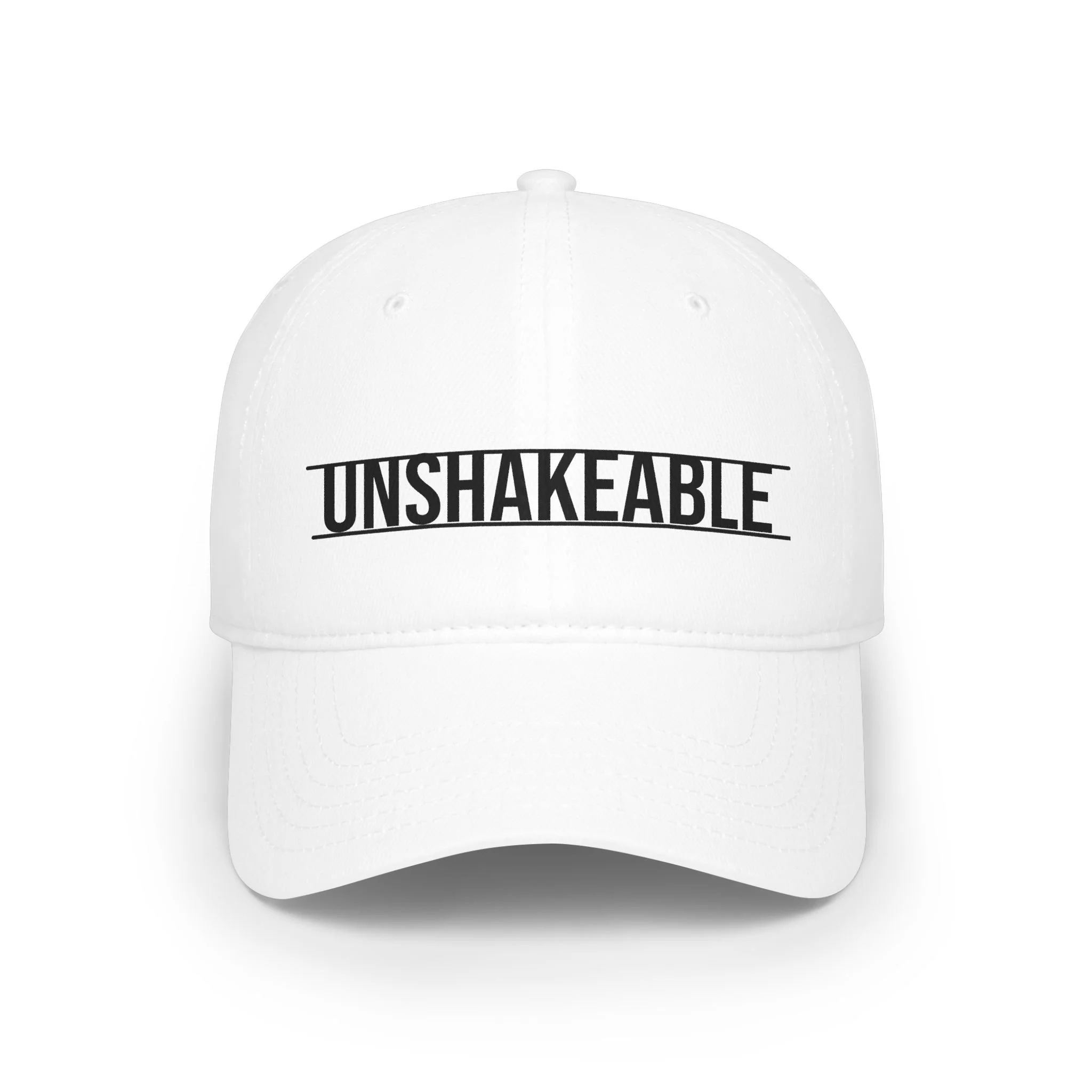 White baseball cap with the word 'UNSHAKEABLE' printed in black capital letters on the front.