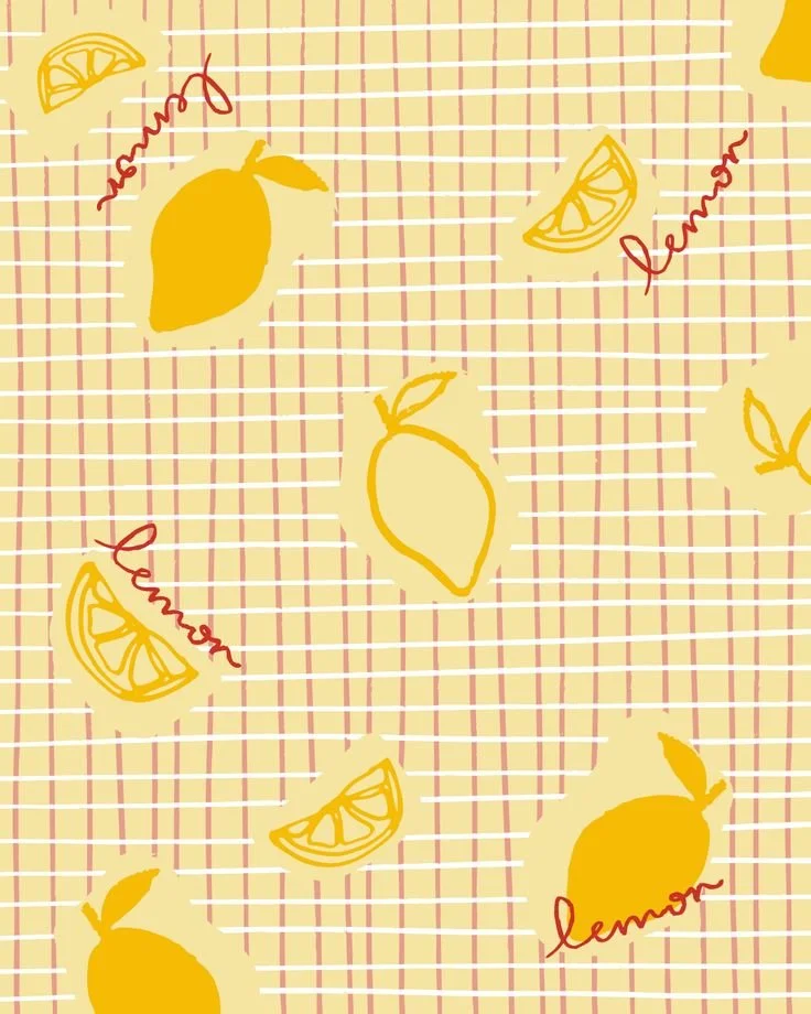 A yellow and red checkered pattern background with illustrations of whole lemons, lemon wedges, and handwritten-style words 'lemon' and 'lemonade' scattered across the design.