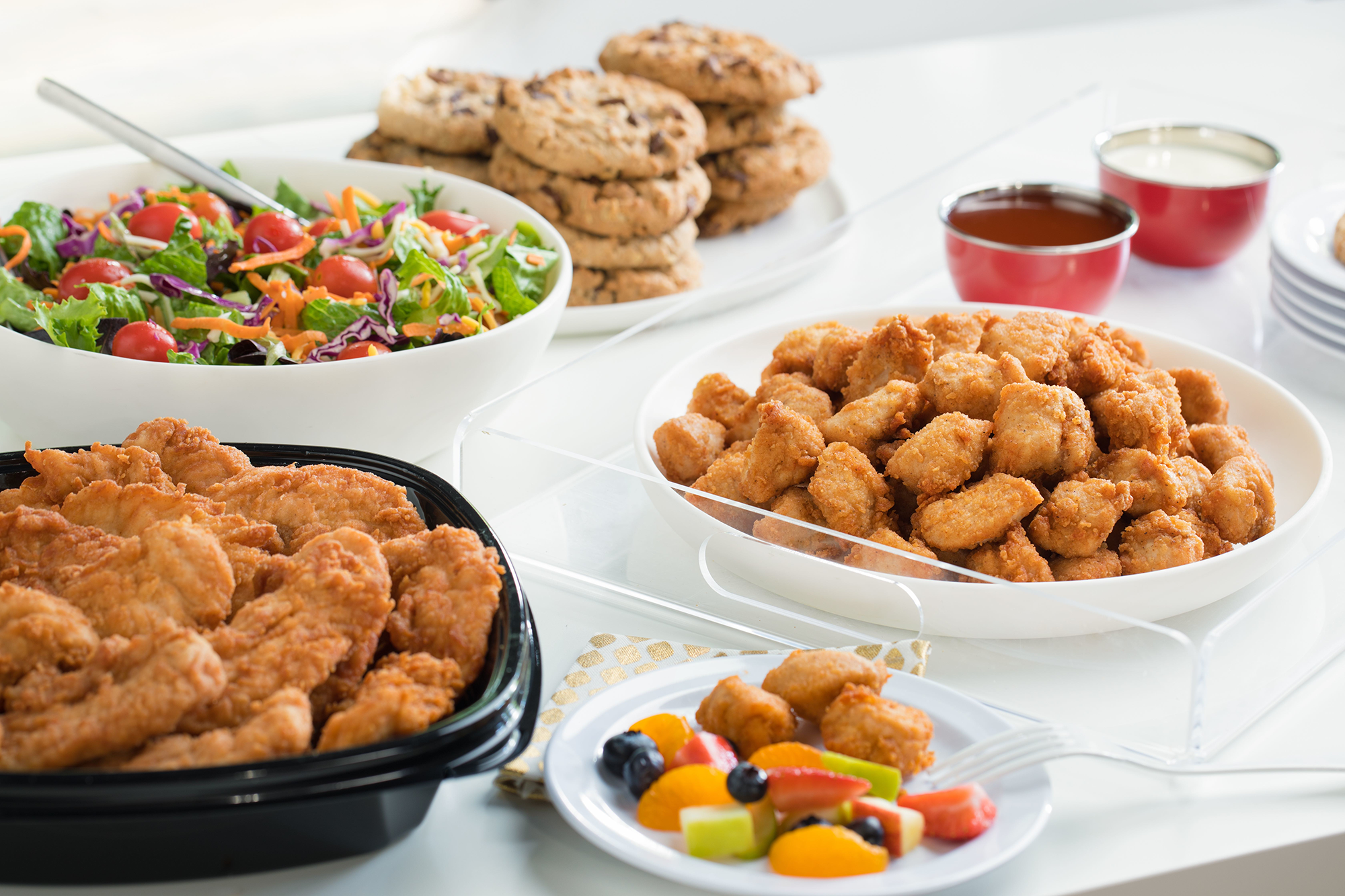 Chick-fil-A Catering with Salad, Cookies, Nuggets and Strips.png