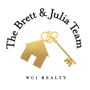 Logo for The Brett & Julia Team featuring a gold house with a key, along with the team name and WCI Realty.