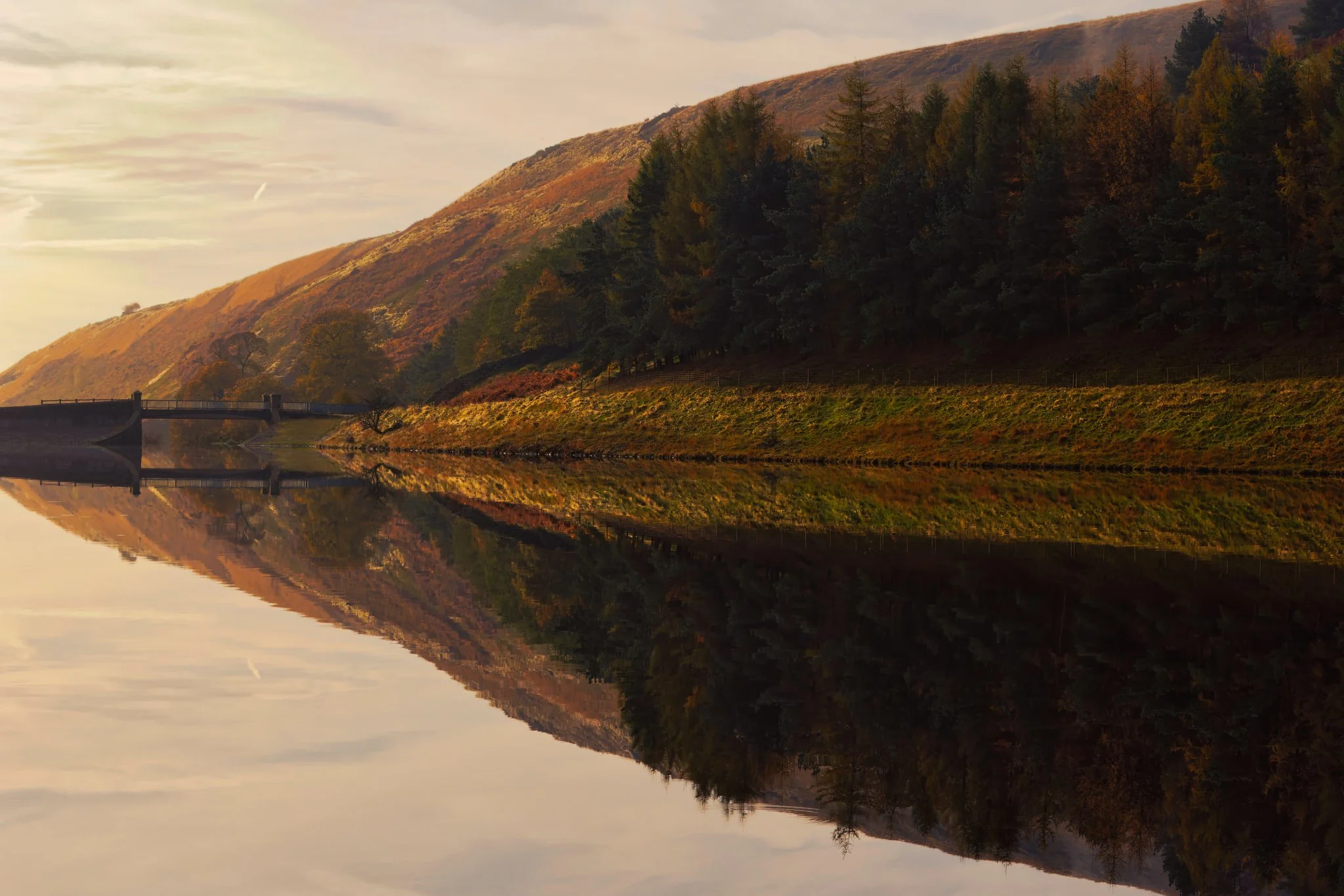 Naden Higher Reservoir — a wider view of the reservoir and surrounding slopes, bathed in gentle, diffuse light.