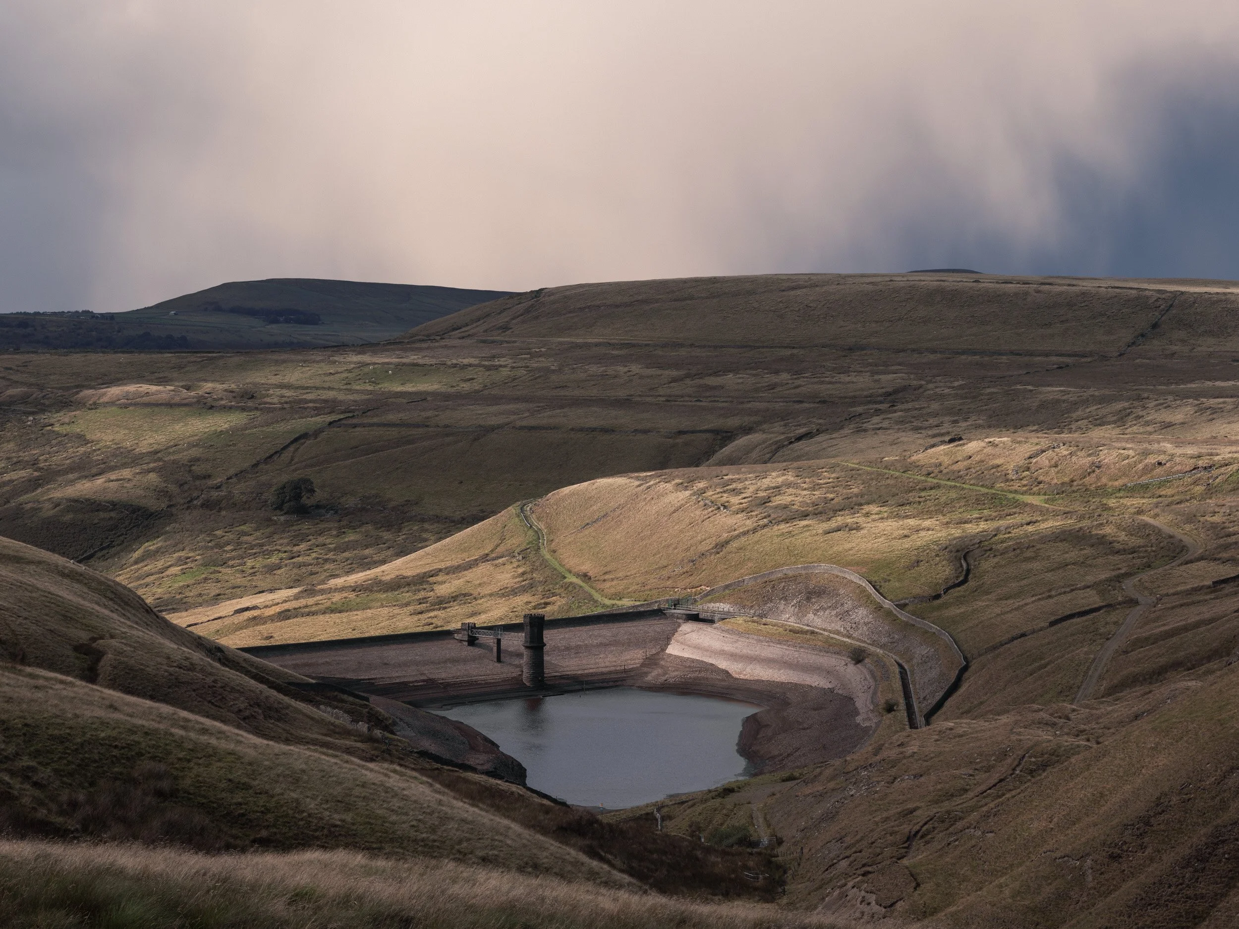 Panoramic view looking towards Cowpe Lowe and Cragg Quarry across the rain-soaked South Pennines moorland