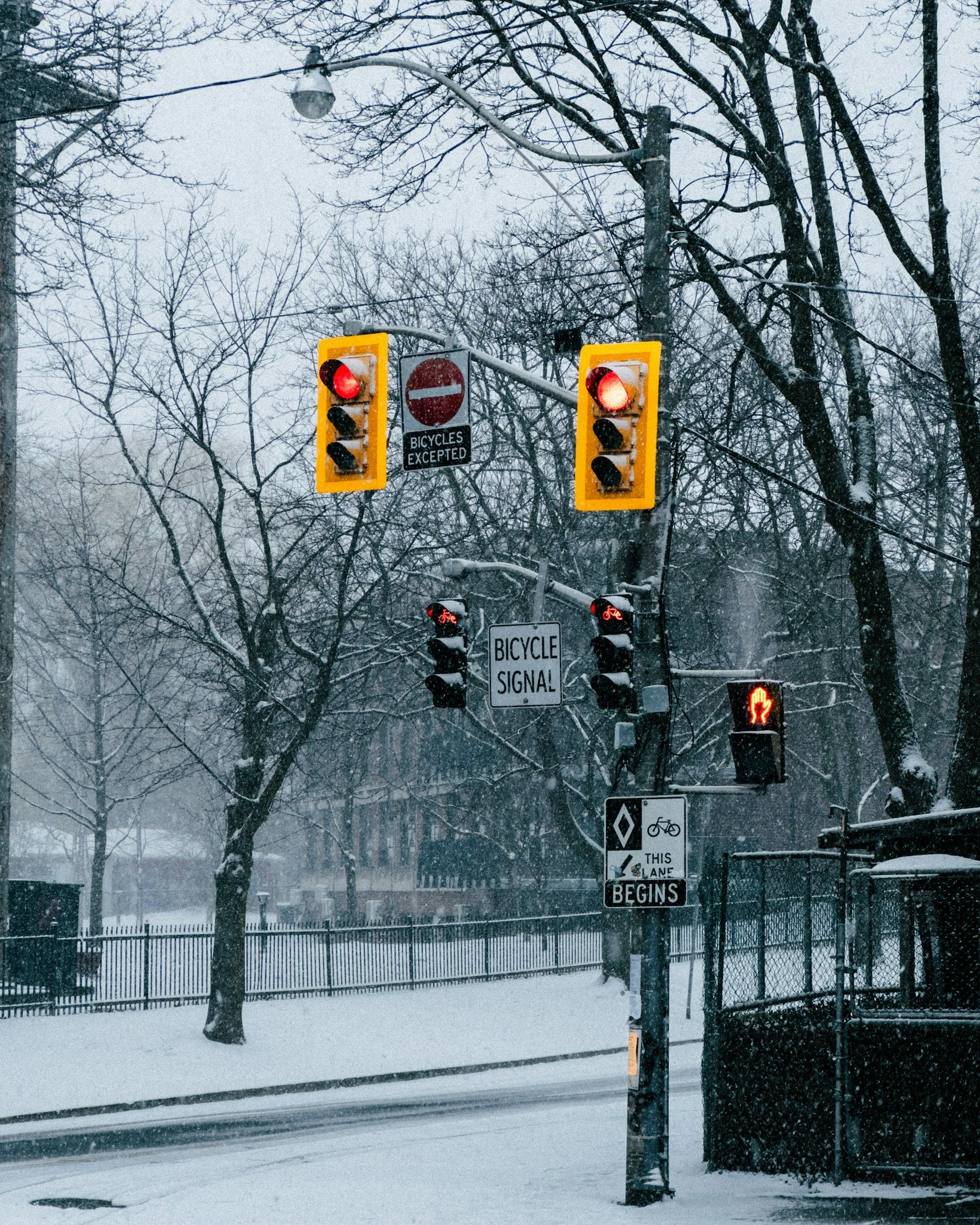 Snow covers a Toronto condo entrance with icy walkways, reminding tenants to stay cautious, report hazards, follow building guidelines, and use Shelterly’s winter advisory steps to remain safe during heavy snowfall.