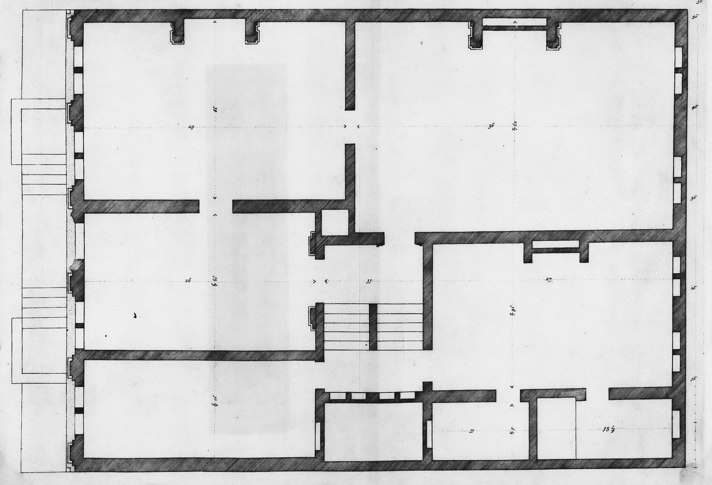 Architectural floor plan of a large building with multiple rooms and staircases.
