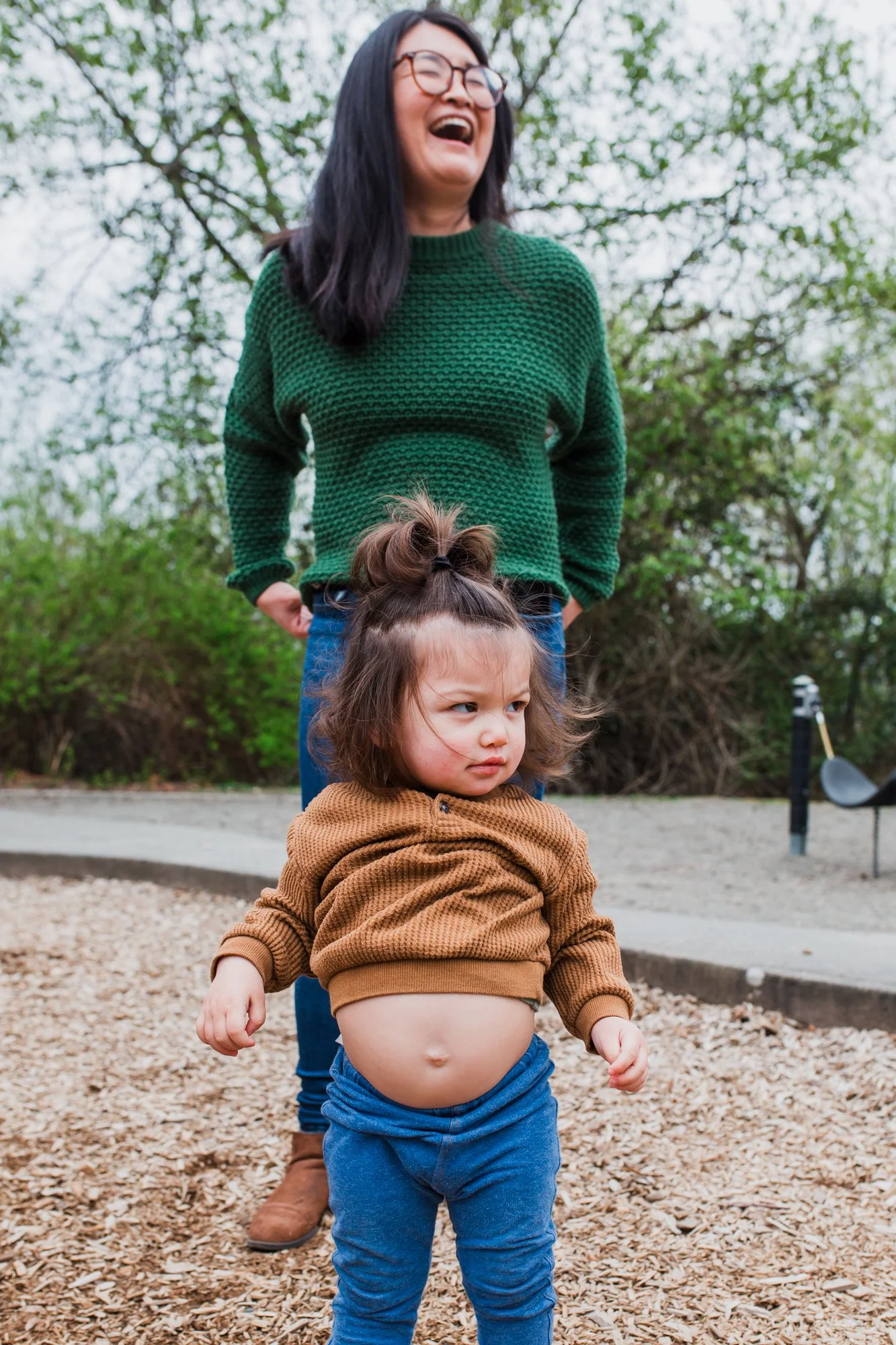 mother and daughter playing at a park