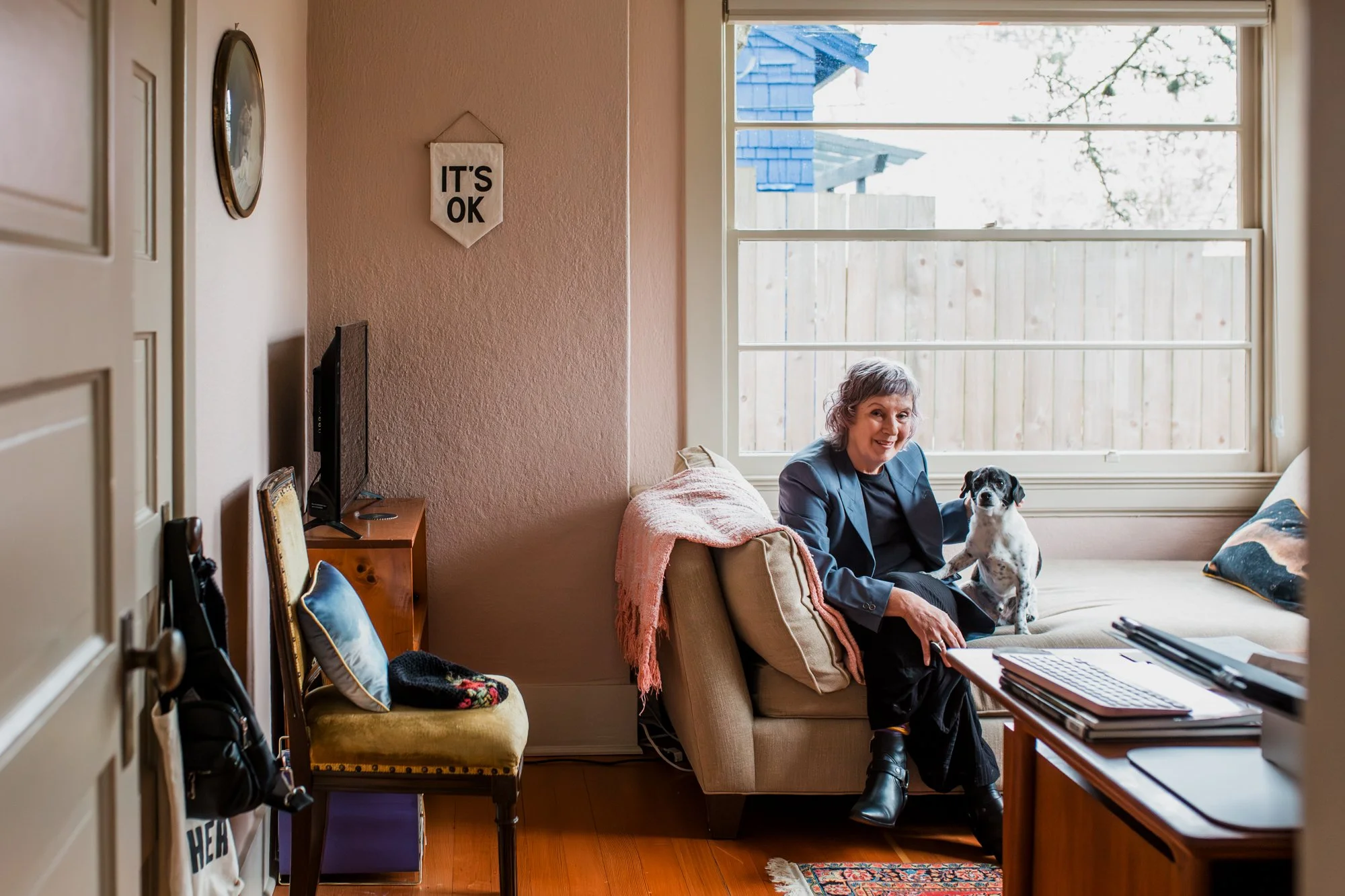 Seattle woman sitting in her office with her dog