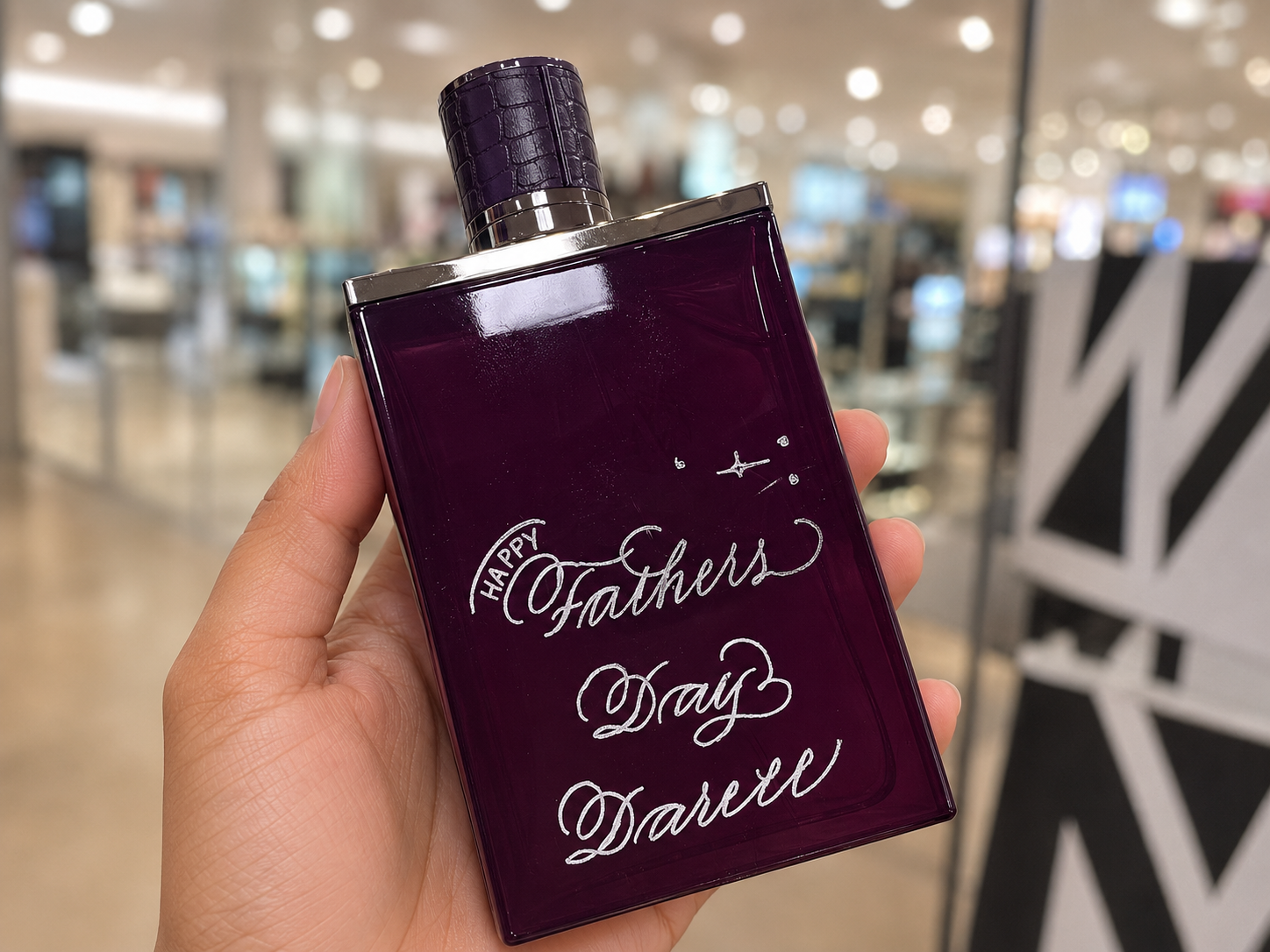Live hand engraving of personalized initials on a luxury product during an in-store brand activation.