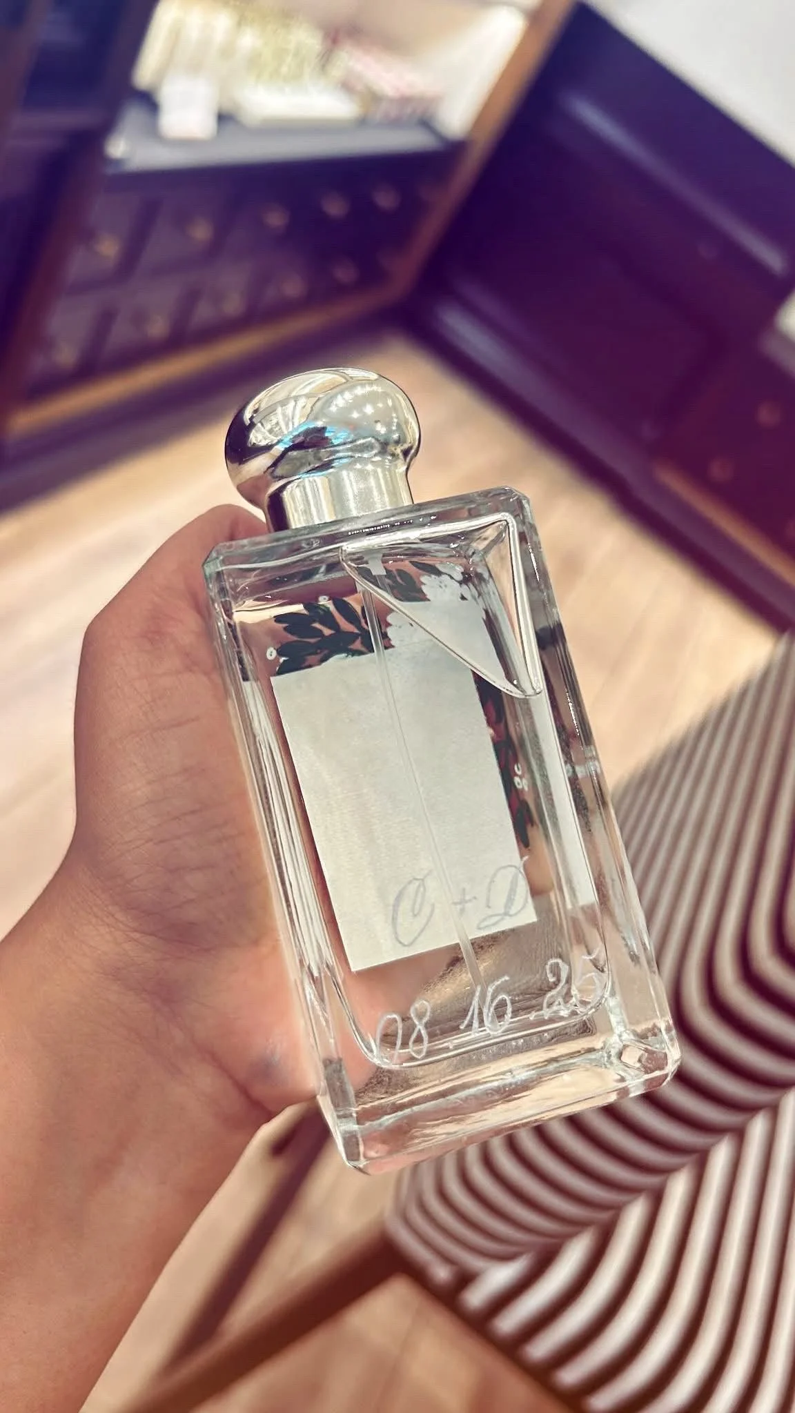 Live hand engraving of personalized initials on a luxury product during an in-store brand activation.