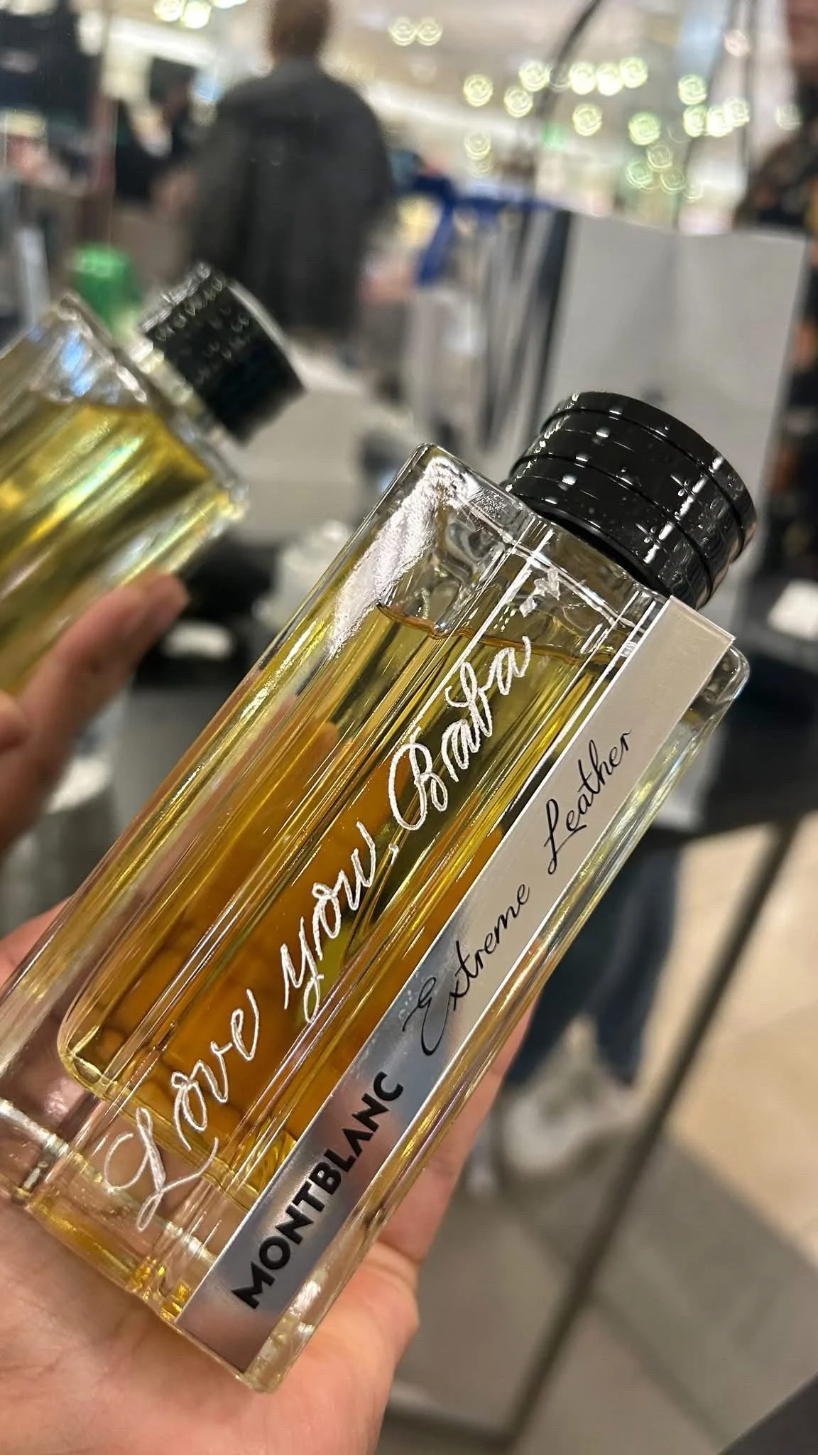 Live hand engraving of personalized initials on a luxury product during an in-store brand activation.
