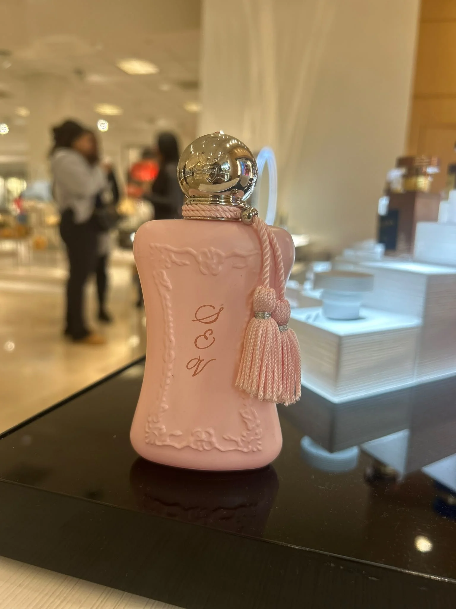 Live event engraving of personalized on a luxury product during an in-store brand activation.
