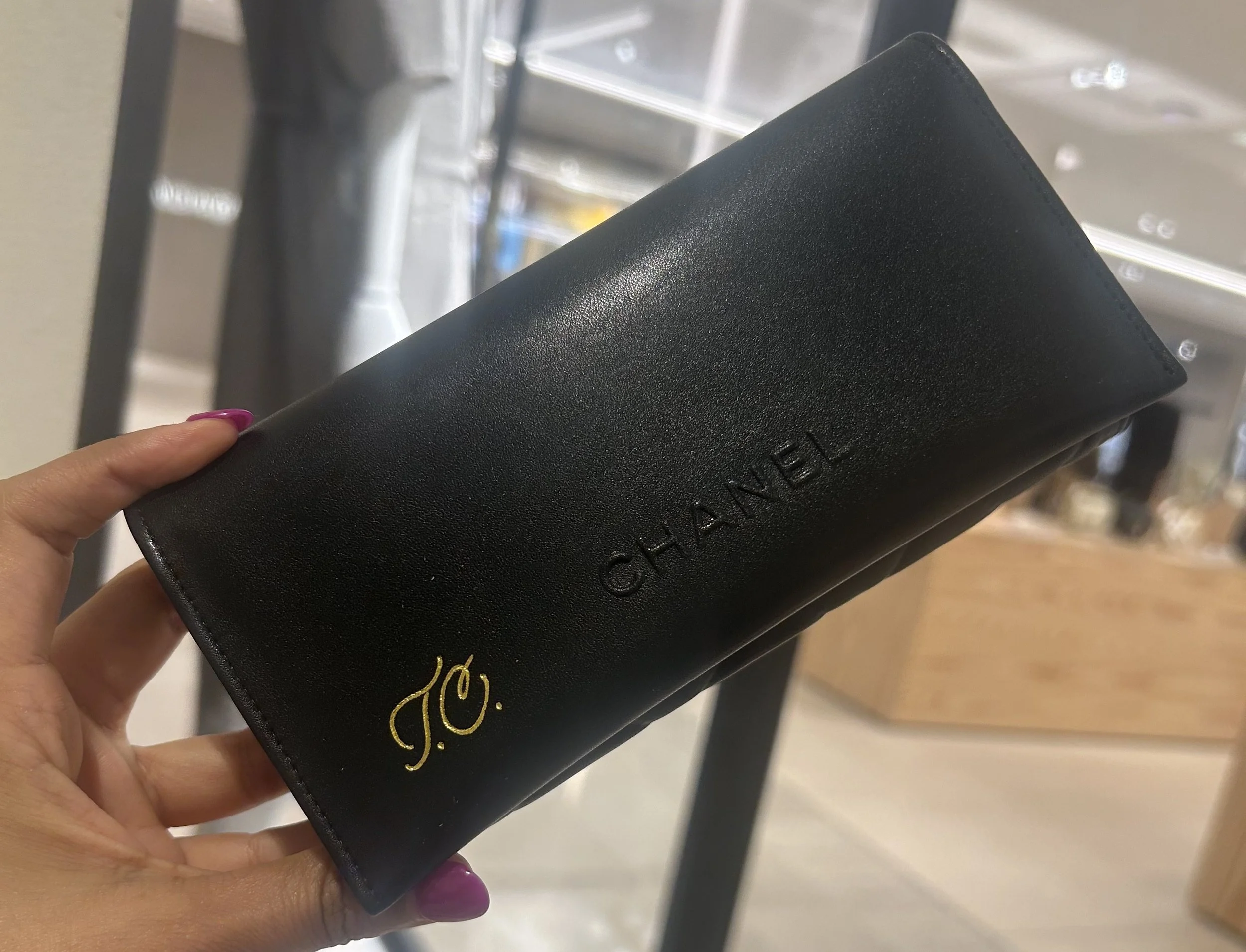 Chanel leather personalization with gold calligraphy for a luxury retail activation in Detroit