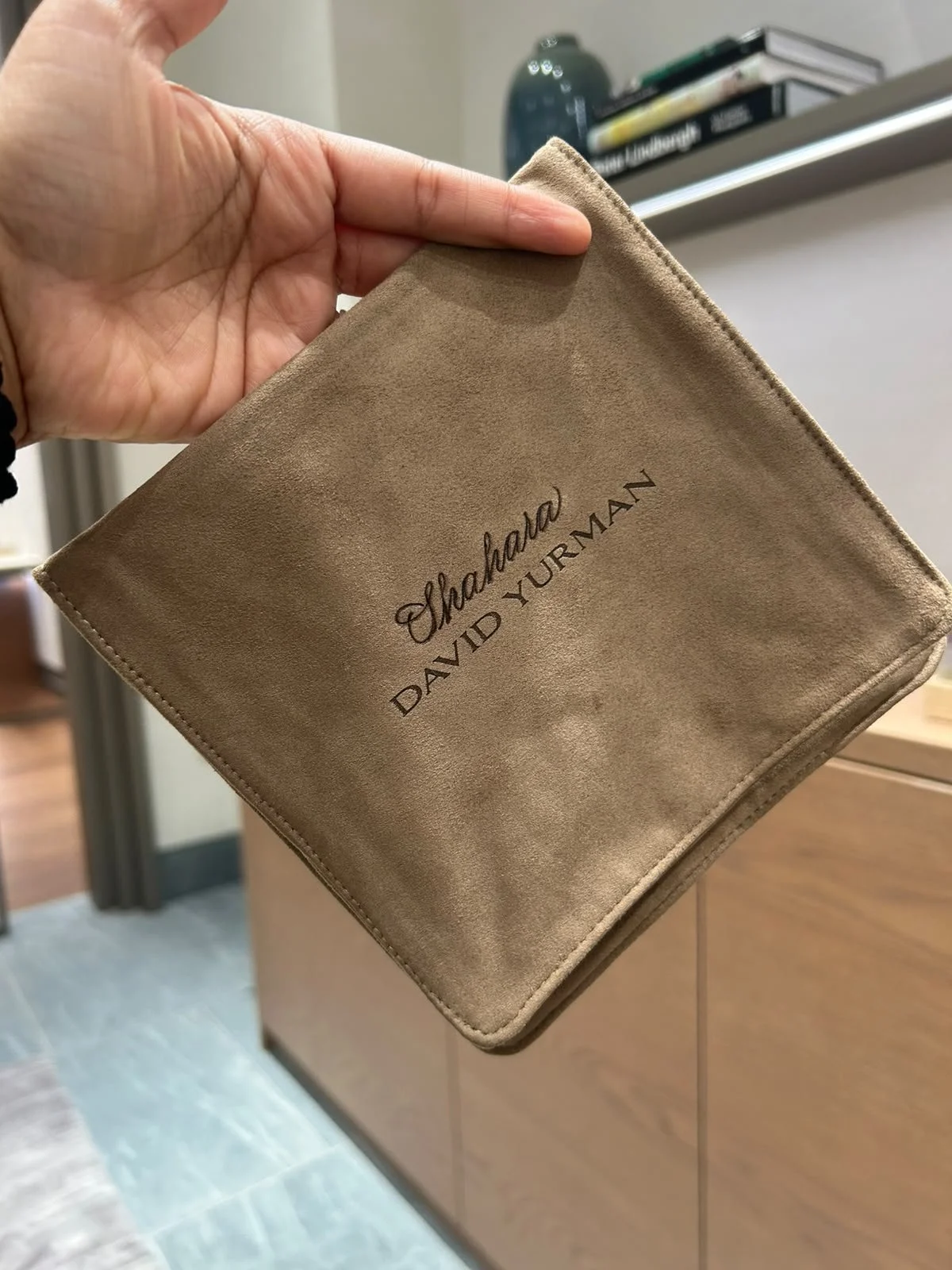 Live leather debossing and engraving on a David Yurman jewelry pouch for a luxury retail activation