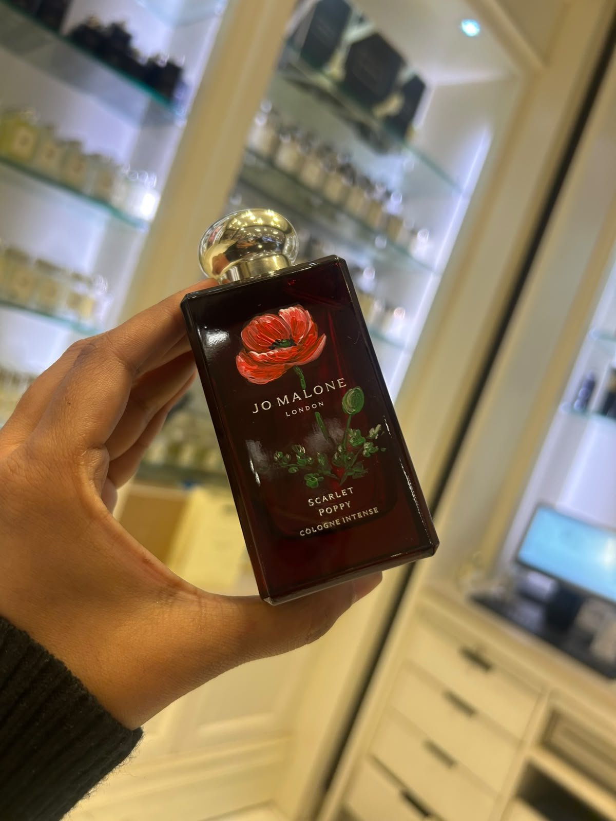 Hand-painted Jo Malone fragrance bottle with custom floral artwork for a luxury retail brand activation.