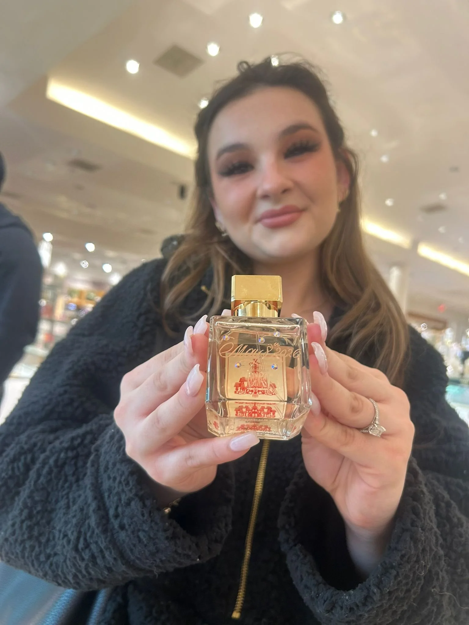 Live hand engraving of personalized initials on a luxury product during an in-store brand activation.