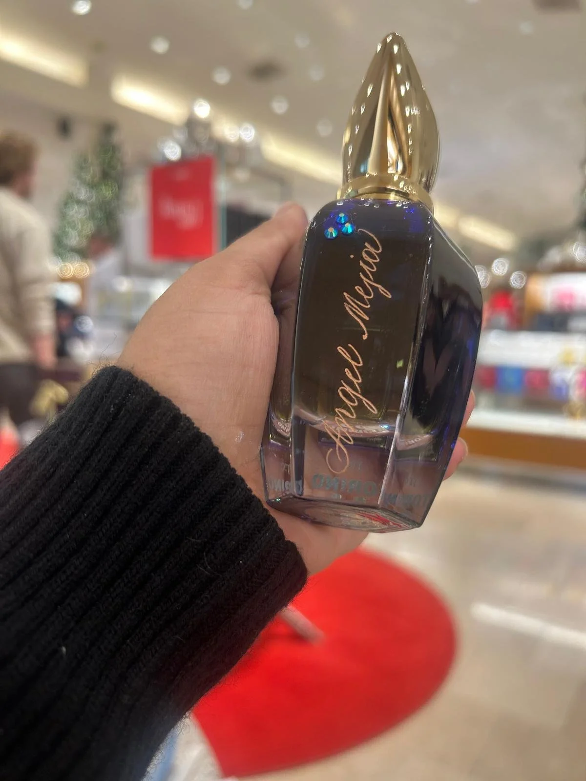 Live hand engraving of personalized initials on a luxury product during an in-store brand activation.