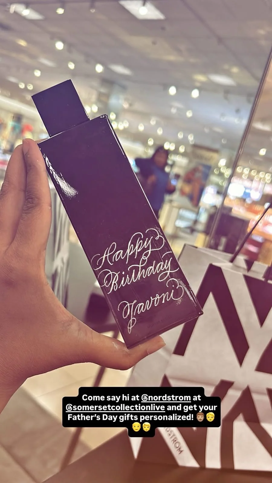 Live hand engraving of personalized initials on a luxury product during an in-store brand activation.