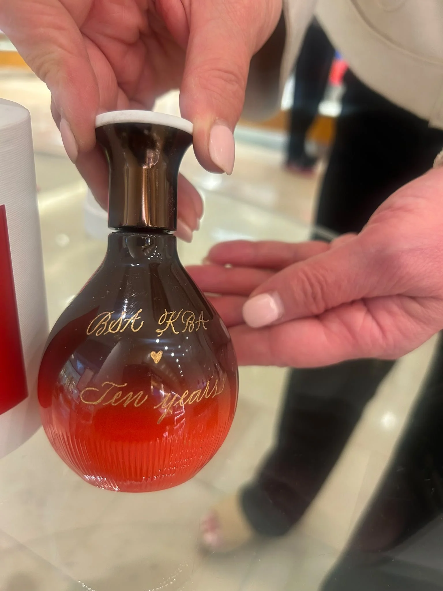 Live event engraving of personalized on a luxury product during an in-store brand activation.