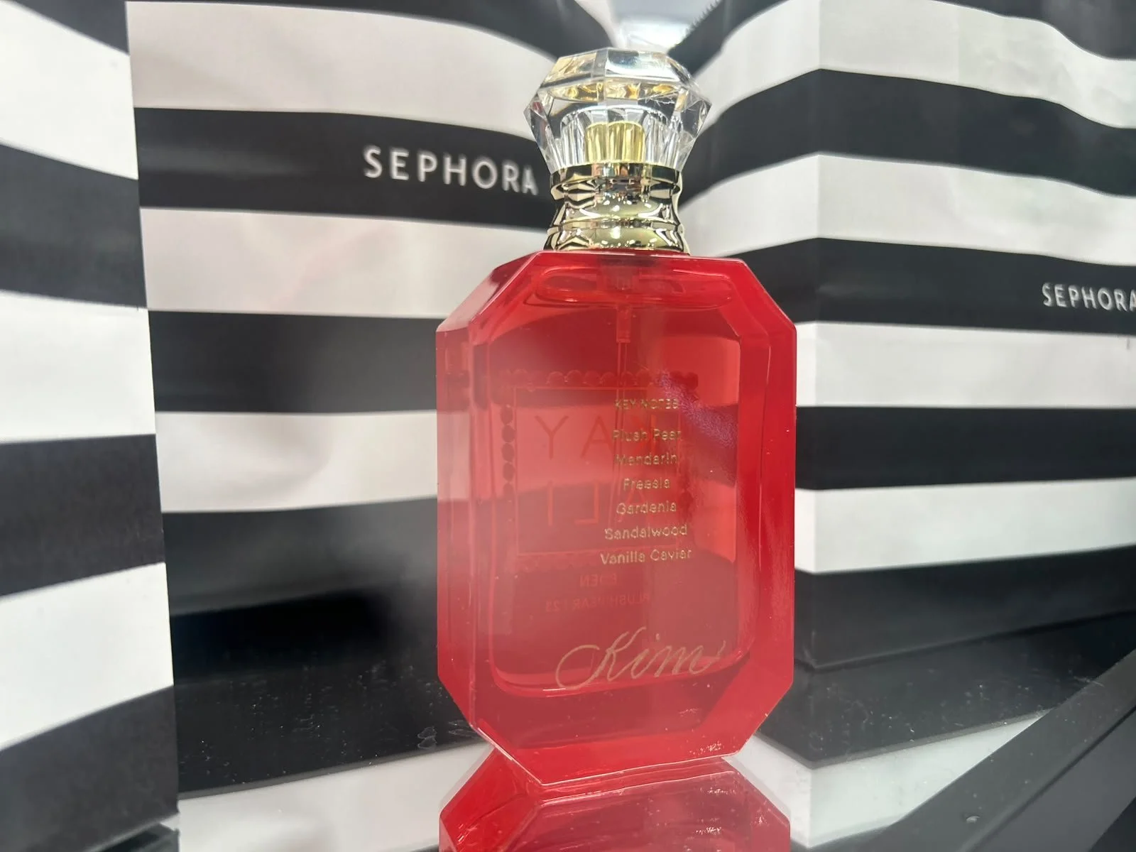 Custom engraved fragrance bottle created during a live engraving activation at Sephora, featuring luxury retail personalization and customer engagement in Chicago.