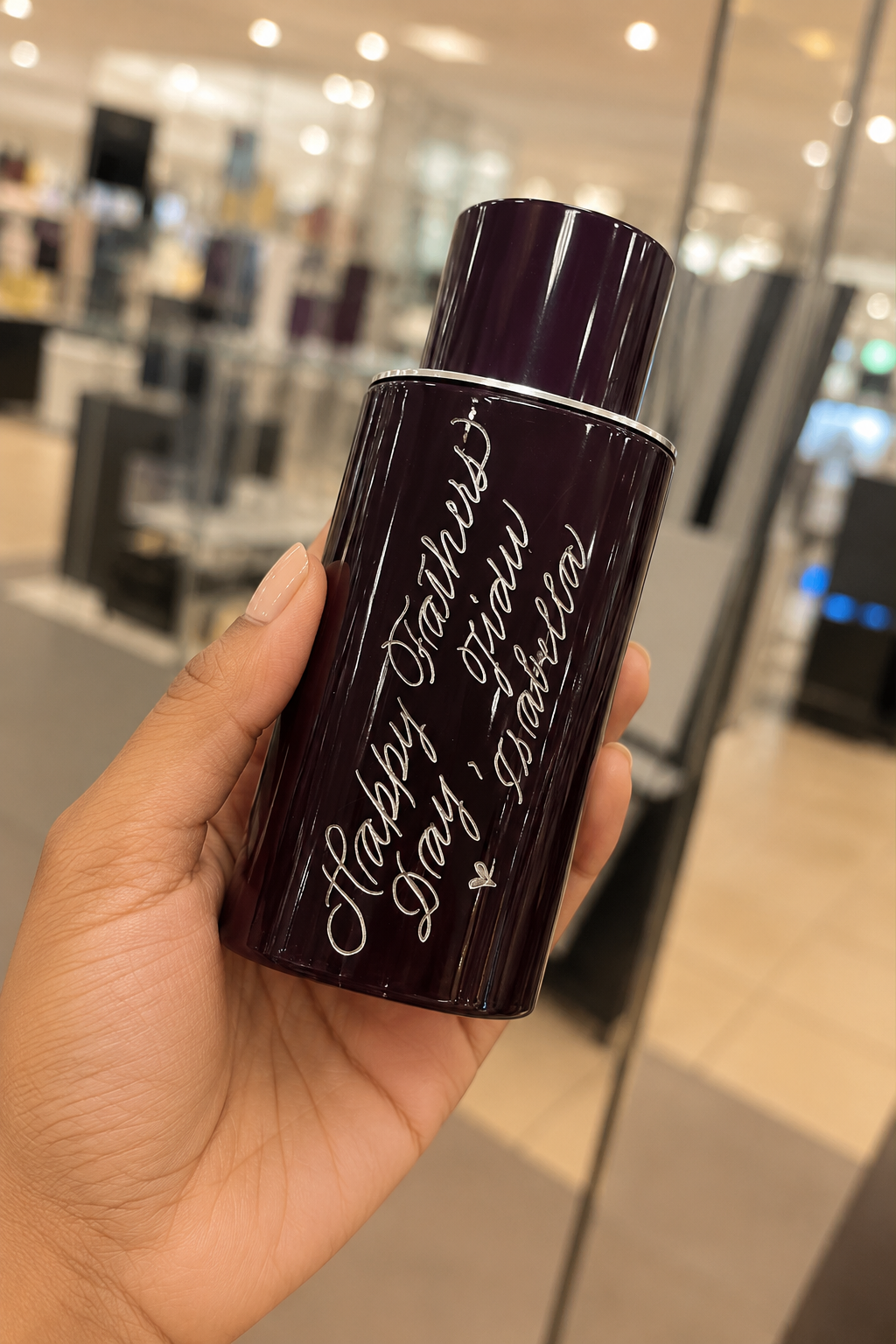 Live hand engraving of personalized initials on a luxury product during an in-store brand activation.