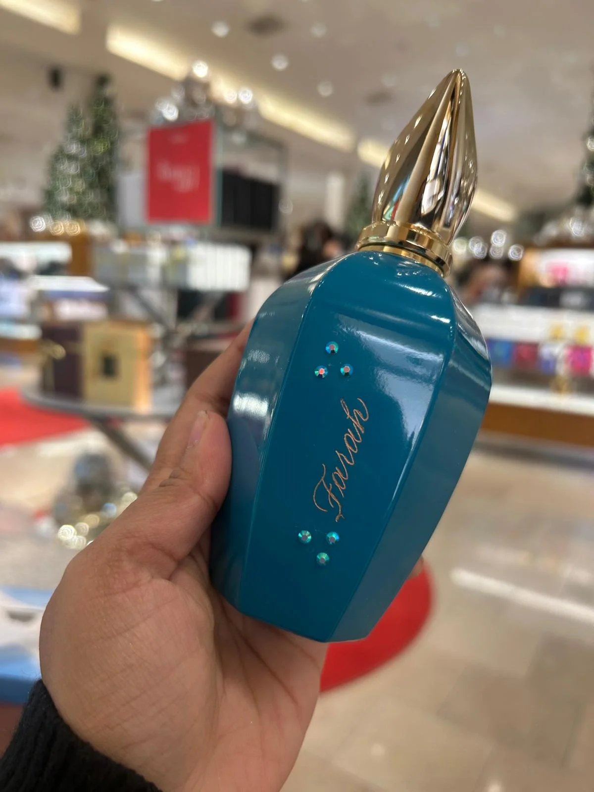 Live hand engraving of personalized initials on a luxury product during an in-store brand activation.