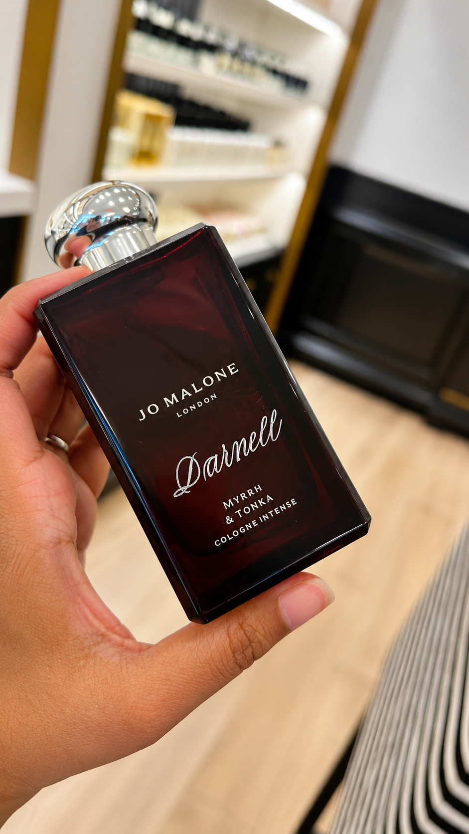 Live hand engraving of personalized initials on a luxury product during an in-store brand activation.