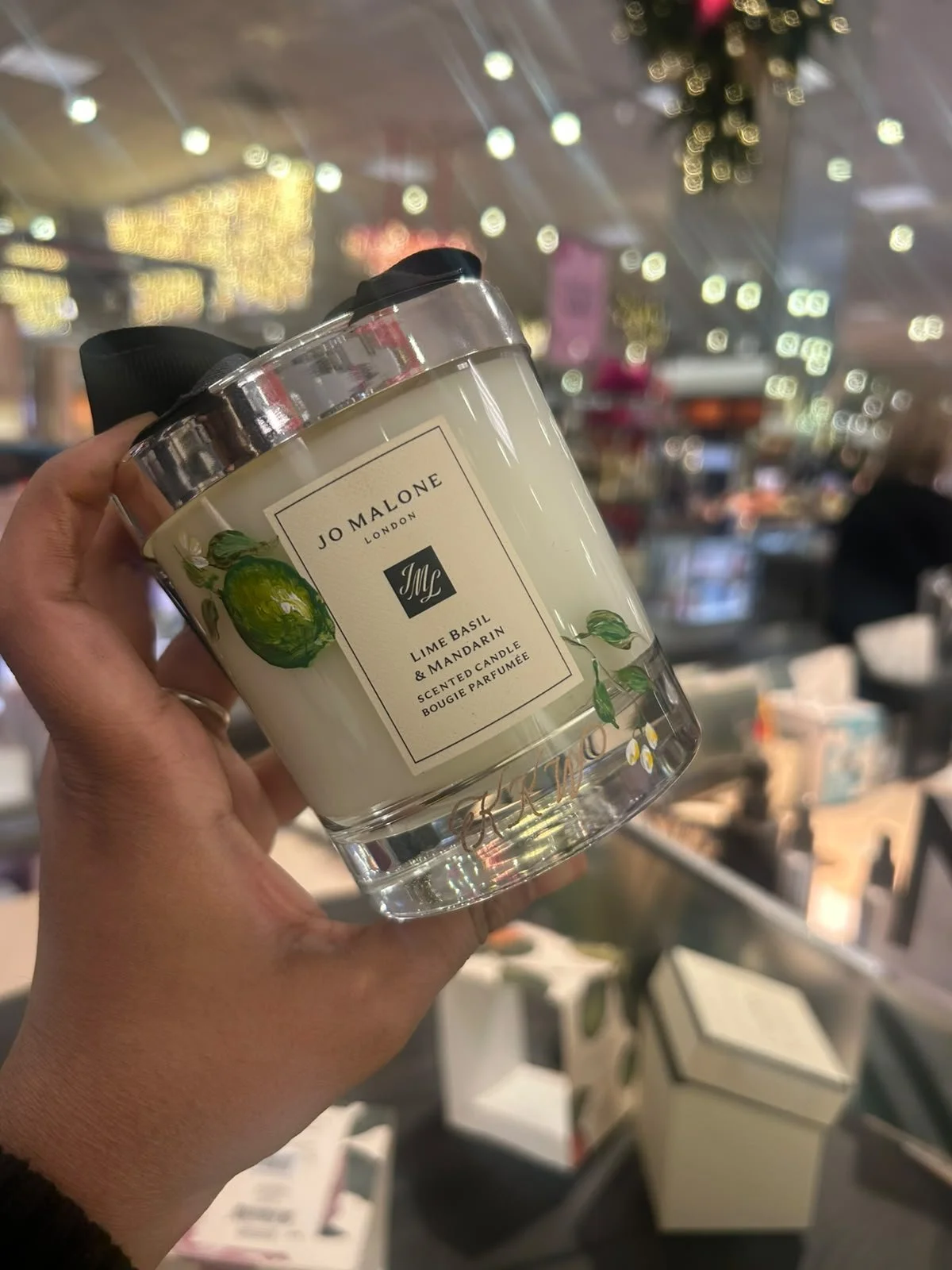 Hand-painted Jo Malone fragrance candle with custom floral artwork for a luxury retail brand activation.