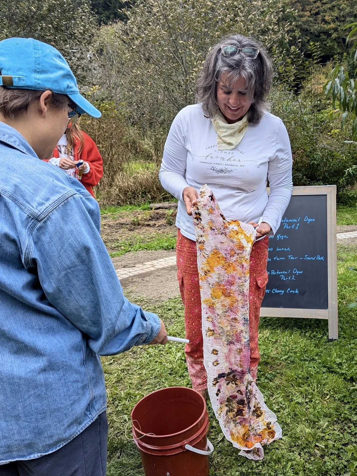 Botanical Dye Retreat and Workshop showing Heather Carnocki unfolding her freshly made scarf