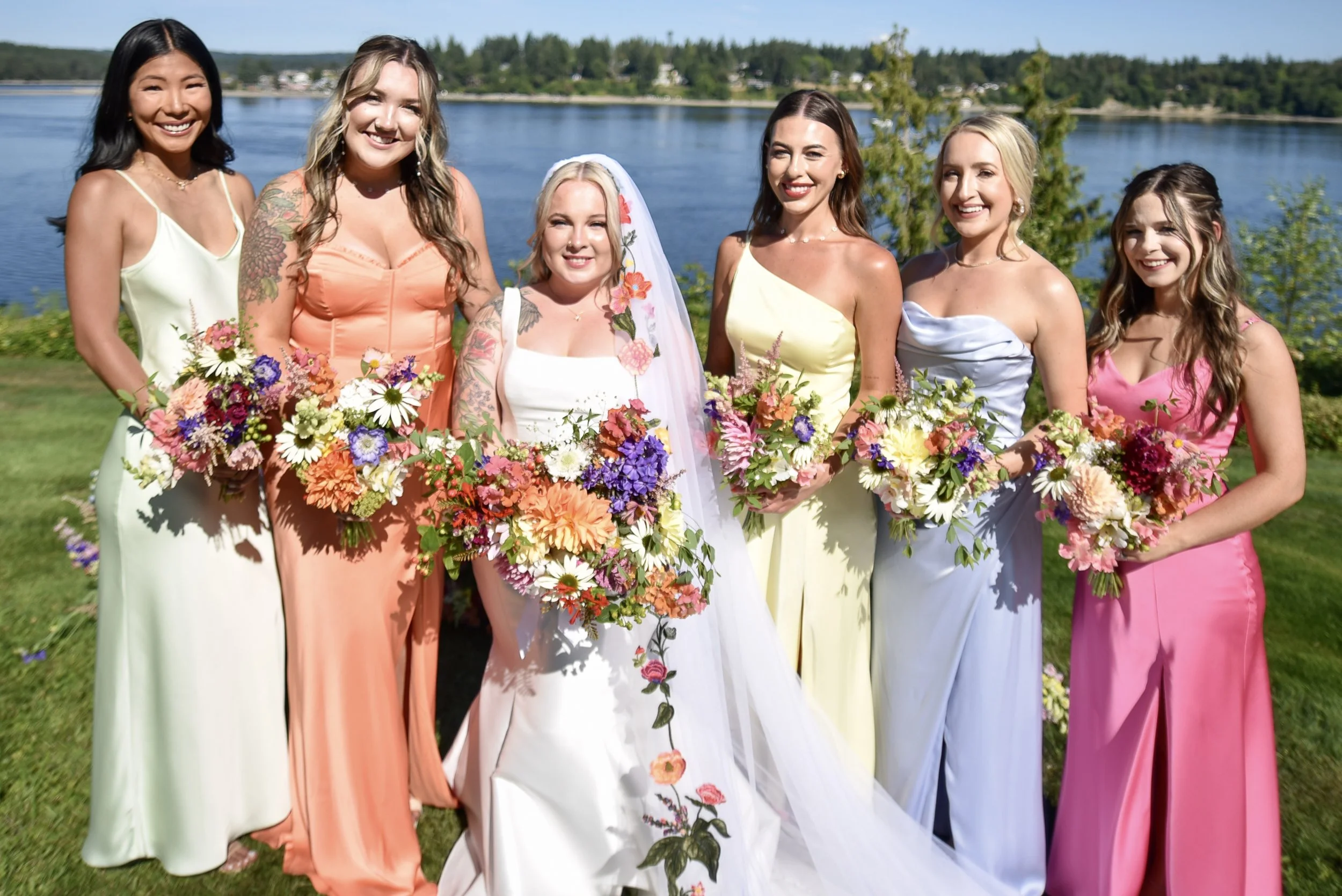 Colorful bridal bouquet.  Bridesmaids bouquets in sherbert, lemon, lime, orange and lilac.