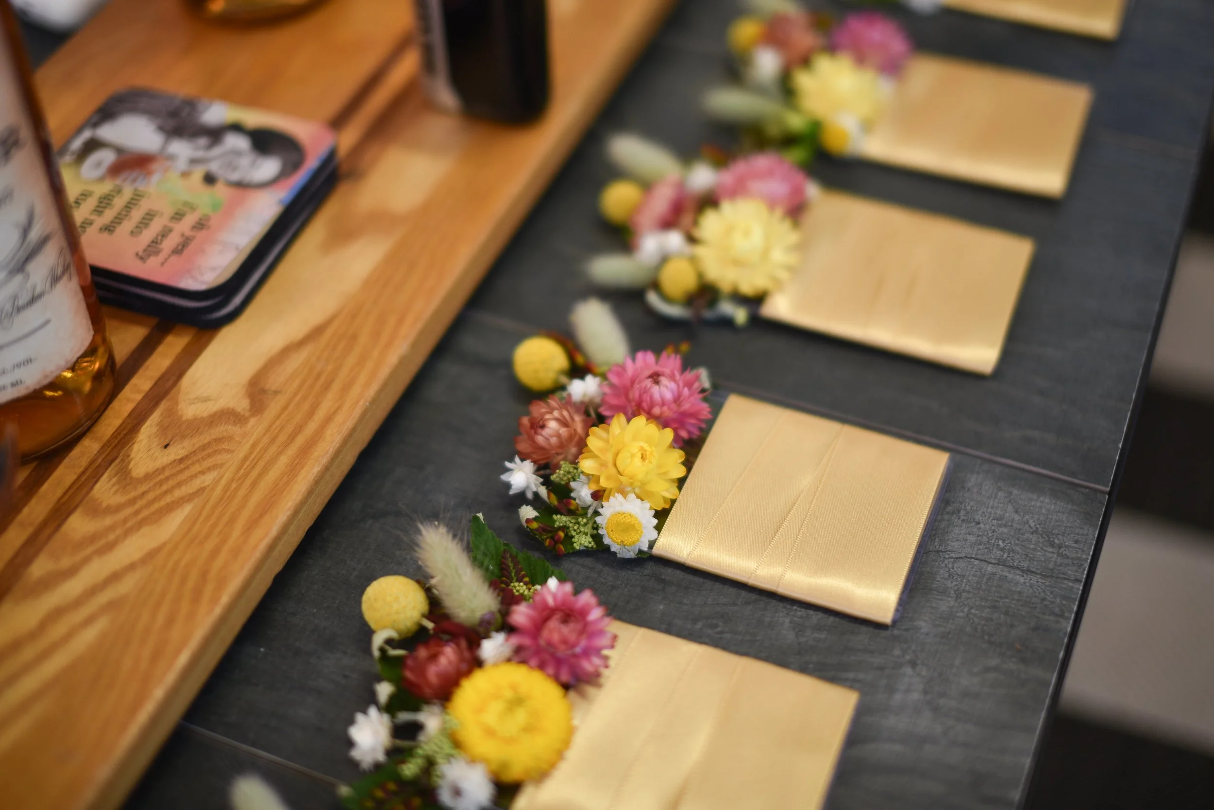 pocket boutonnières made with dried flowers, grasses and fresh flowers.