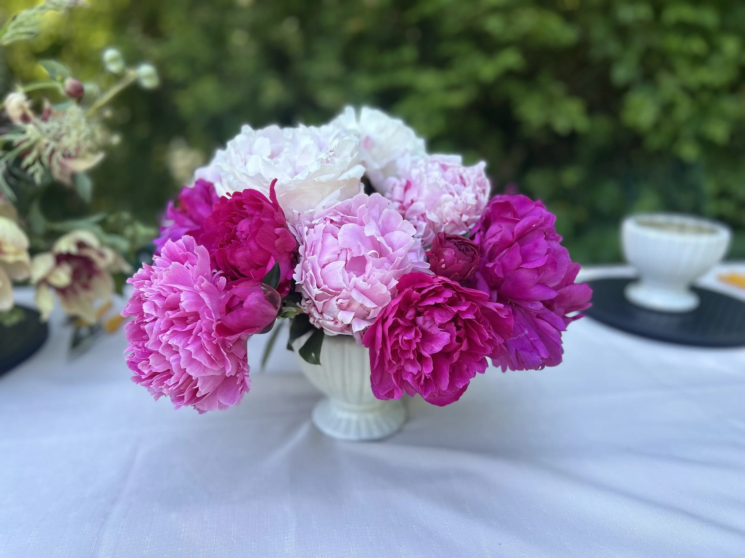 Large bouquet of fuchsia, pink and white peonies
