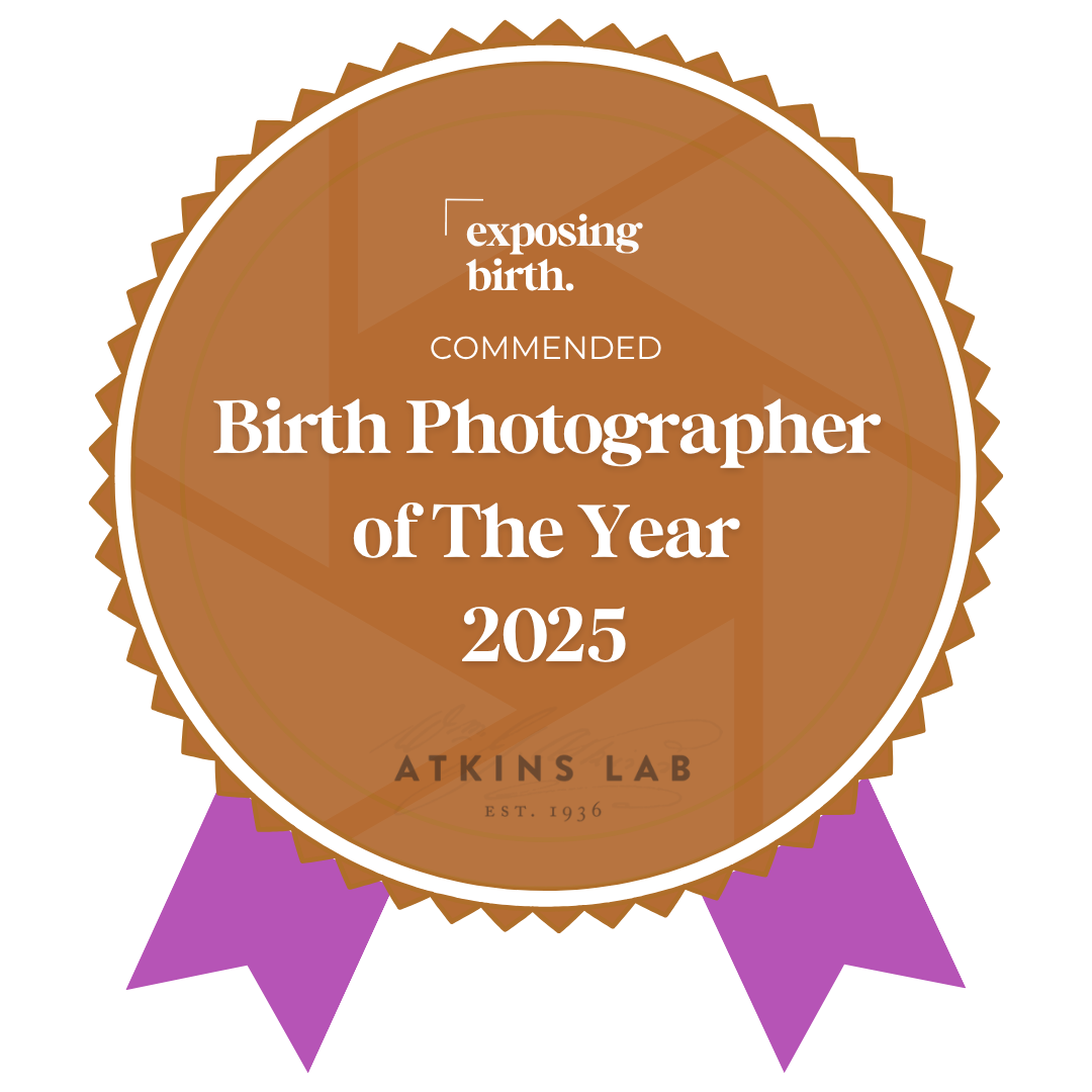 Award badge for 'Birth Photographer of The Year 2025' awarded by Atkins Lab, emphasizing exposure of birth.