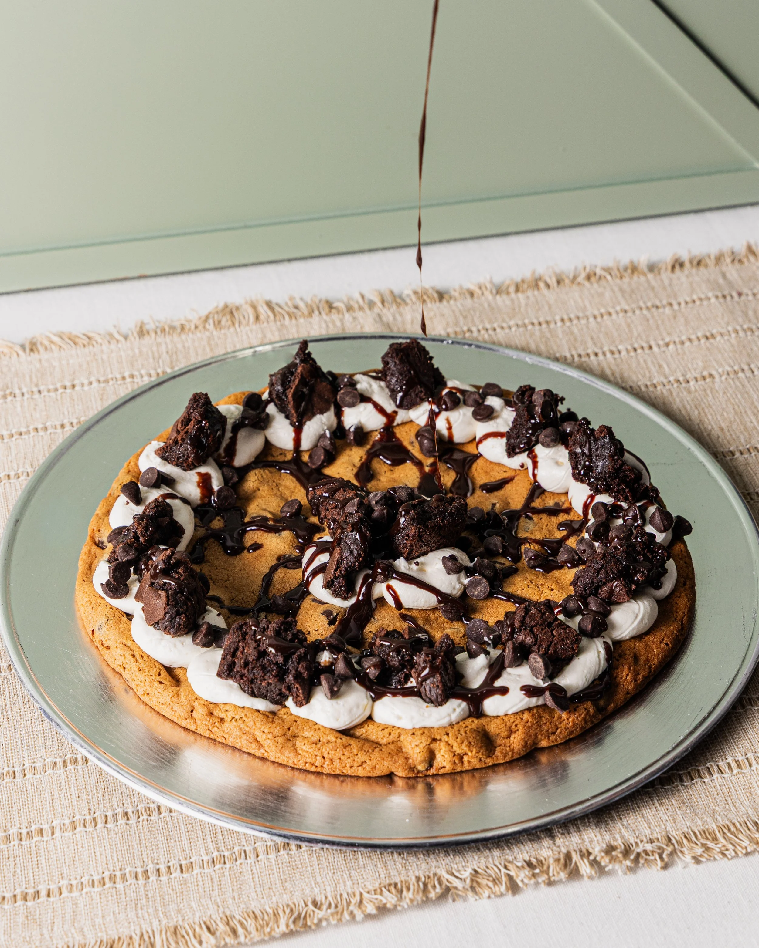 August 2026_Cinnaholic_Cookie Cake_Action_07.jpg