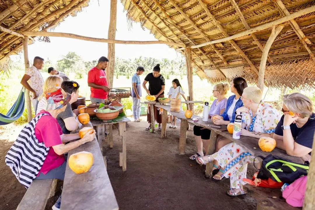 Asia Sustainable Travel - Intrepid-Travel-Sri-Lanka-Dambulla-Chena-Cultivation-Tour-group-cooking.jpg