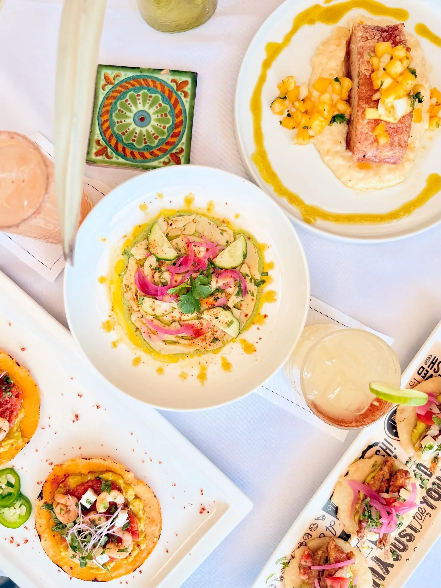 One table. Everything at once.

Aguachile.
Tostadas.
Tacos.
Fire. Citrus. Crunch.

A full expression of the menu, meant to be shared, mixed, and experienced together.

This is the spirit of the week.

#SGM26 #HaitiBites #FoodExperience #TijuanaXAyiti