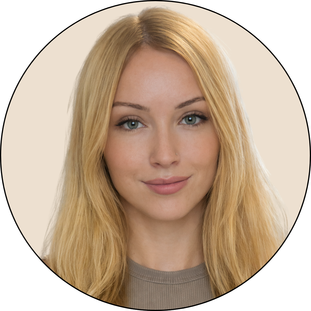 Portrait of a young woman with blonde hair and blue eyes, smiling slightly, against a neutral background.