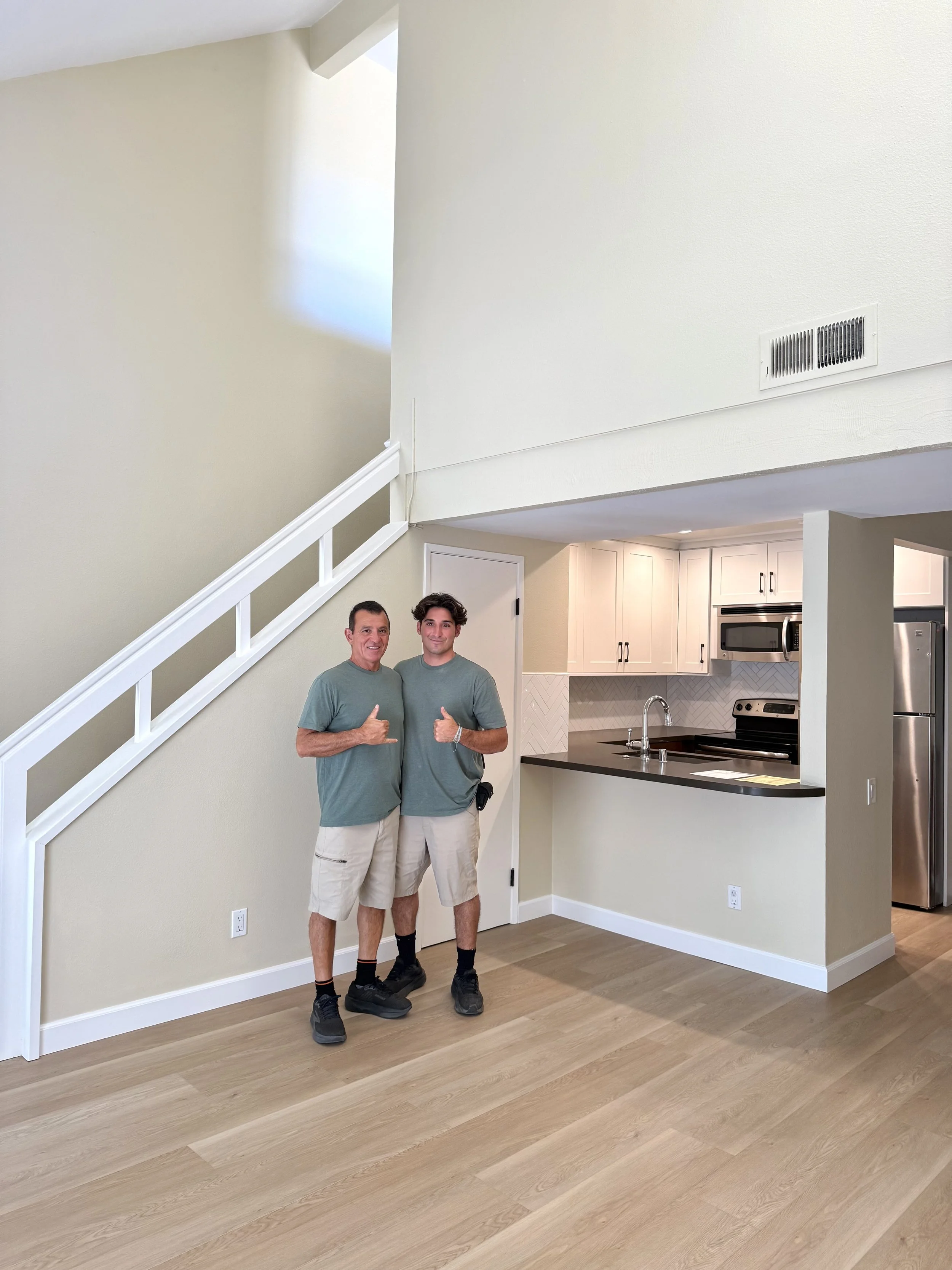 Mark and Charlie after completing a remodel.