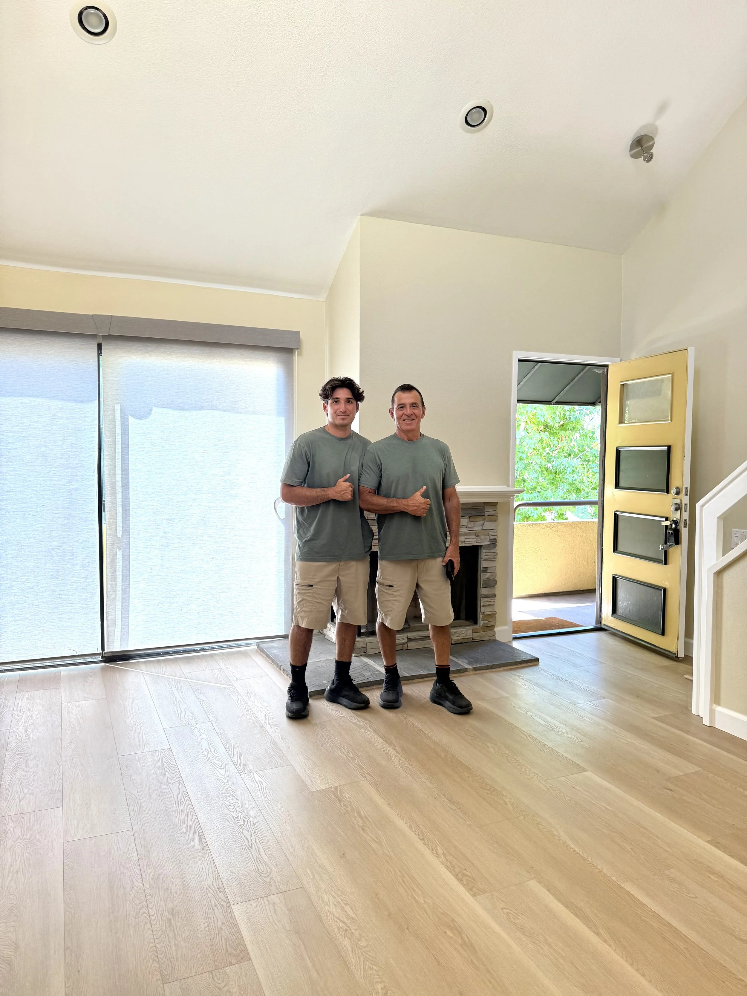 Mark and Charlie after completing a remodel that included new flooring and paint.