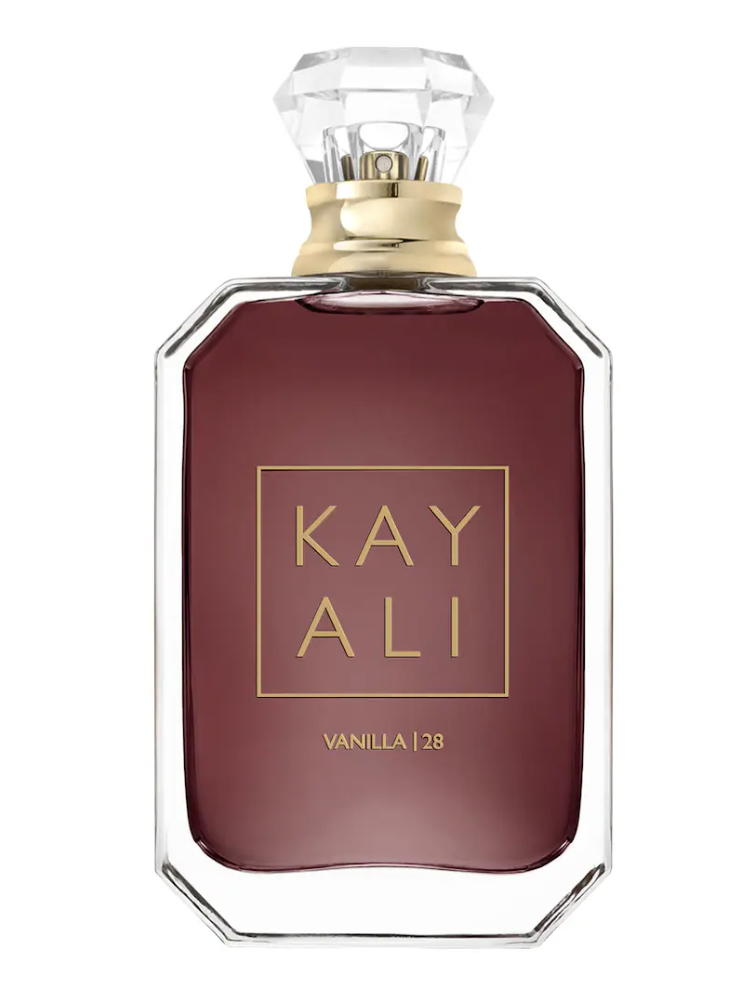 A bottle of Kayali Vanilla 28 Eau de Parfum with a deep amber liquid and a signature geometric gold cap.