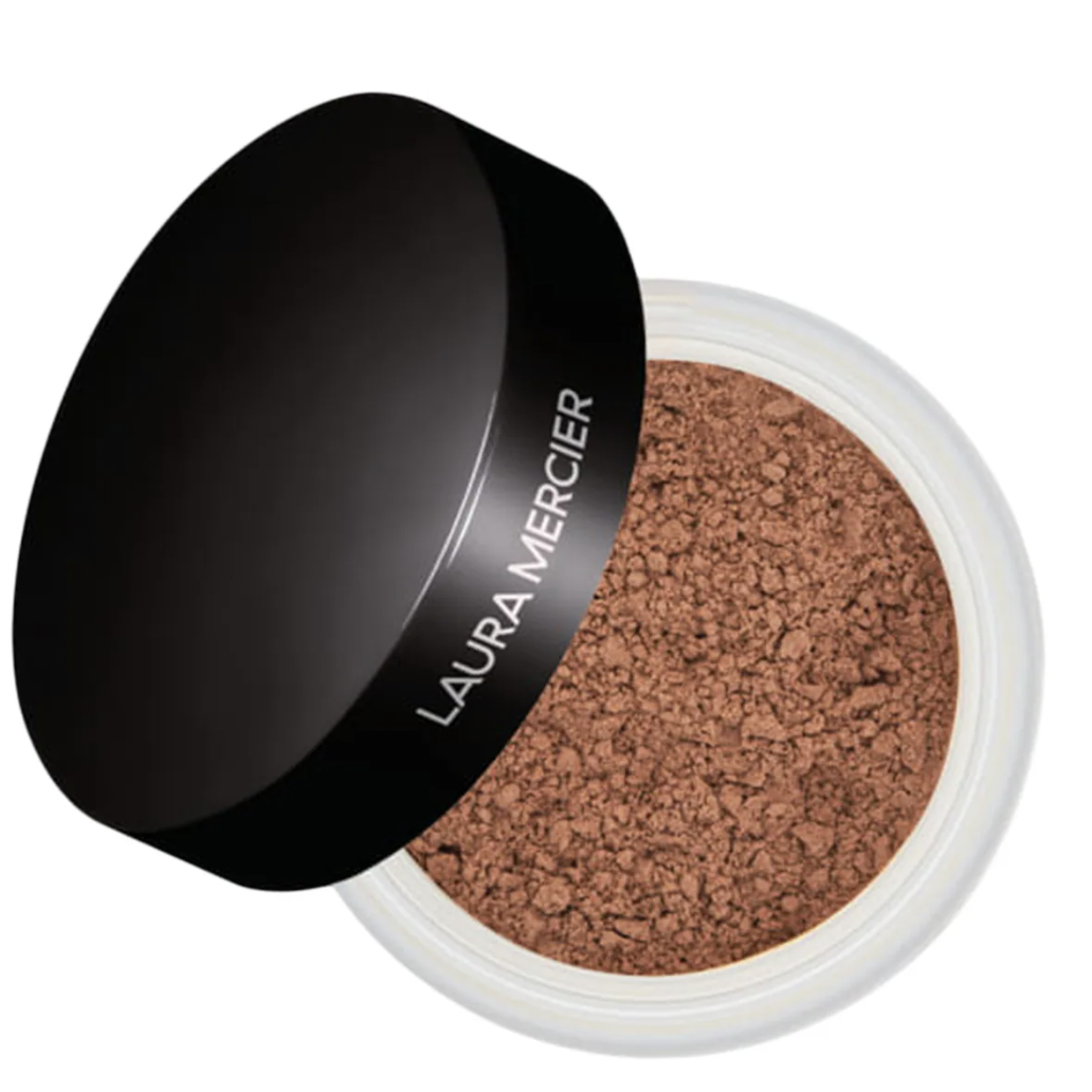 A close-up view of an open jar of Laura Mercier Translucent Loose Setting Powder, showcasing the fine powder texture alongside the black twist-off cap.