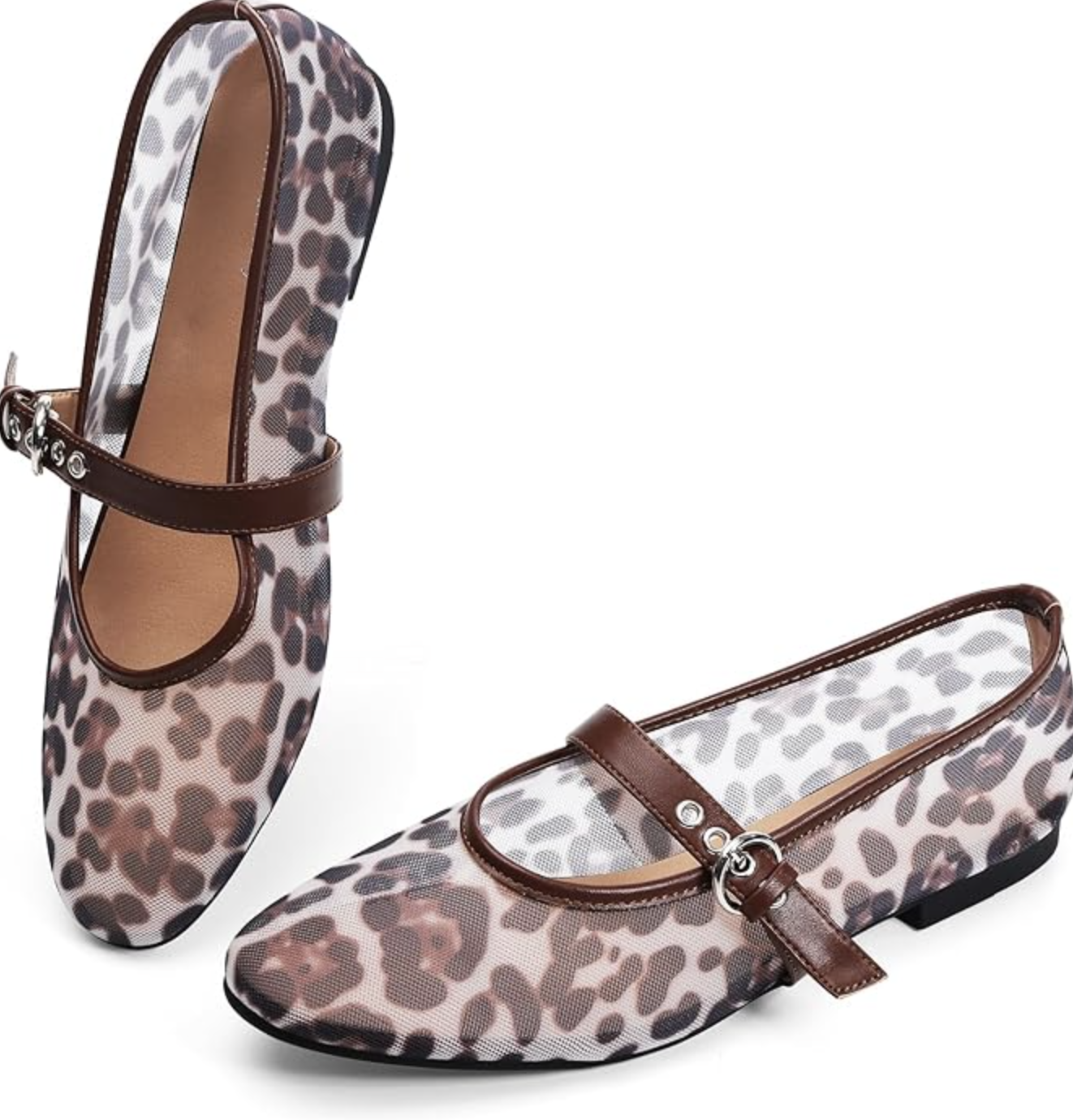 A pair of leopard print calf hair Mary Jane flats for women with a round toe and a single black buckled strap, shown on a white background.